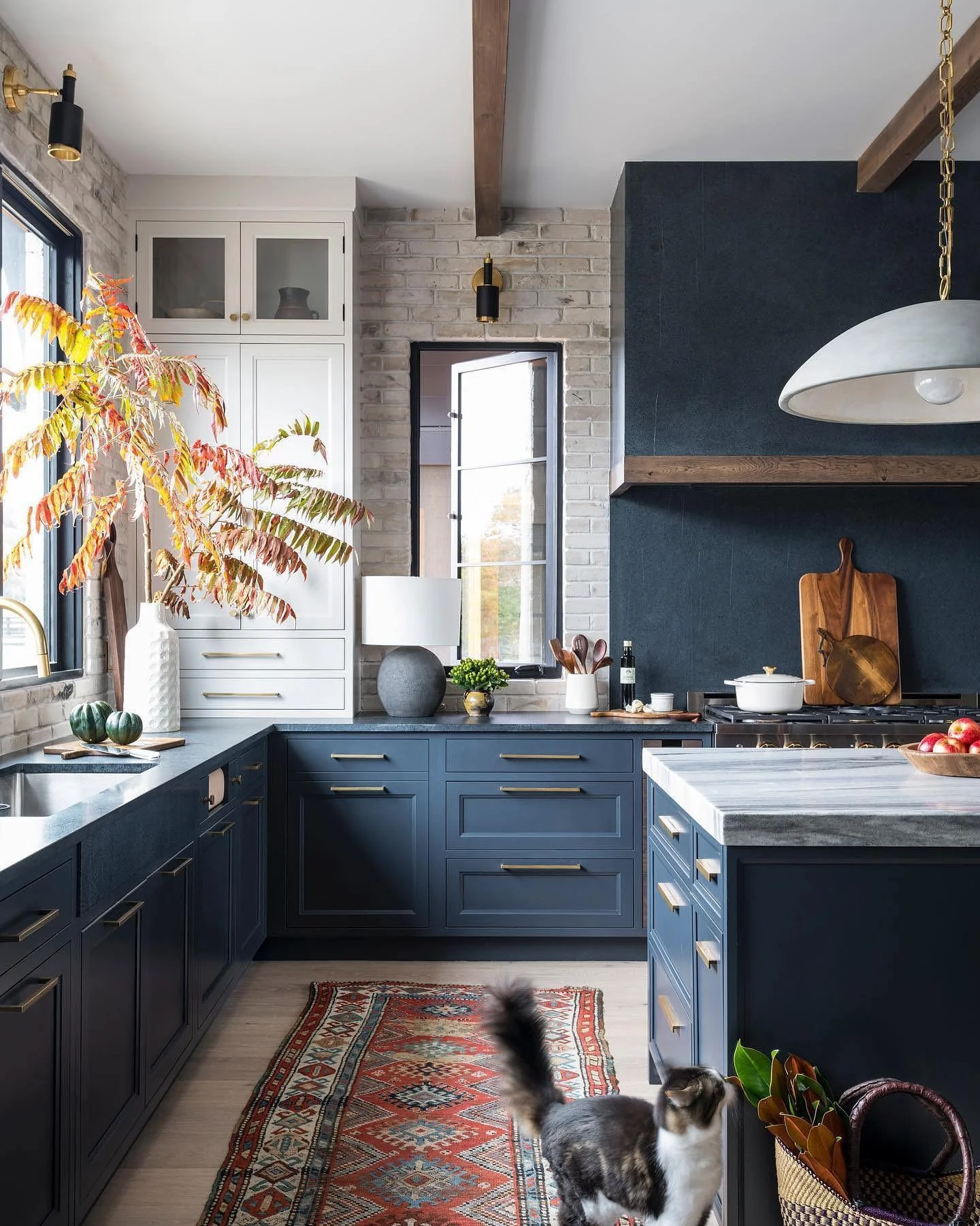 Soften Dark Cabinets with Textured Brick Walls