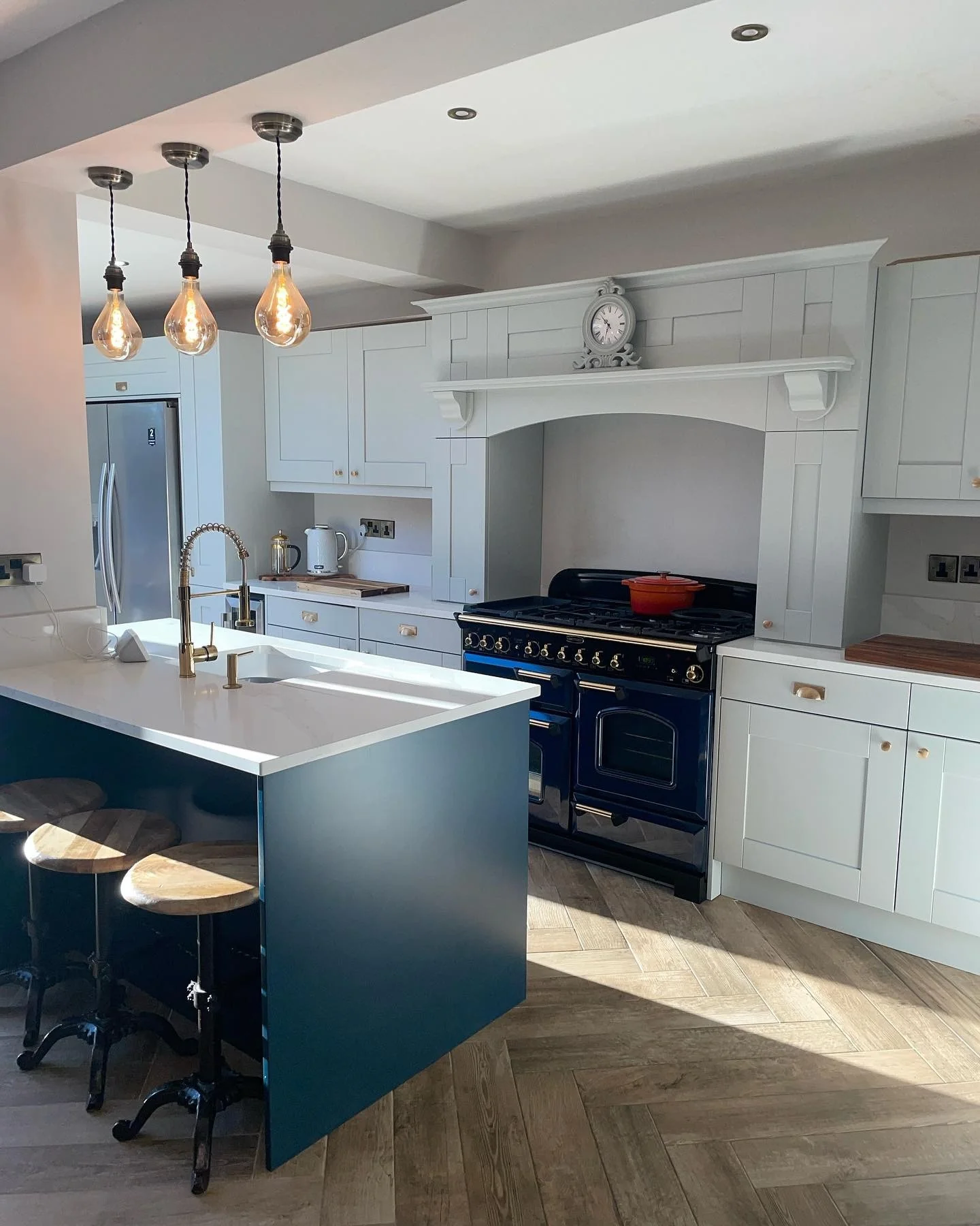 Blue and Grey Kitchen with Herringbone Wood-Look Flooring