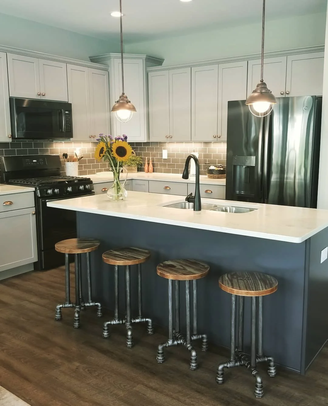 Dark Blue Island with Industrial Pipe Stools