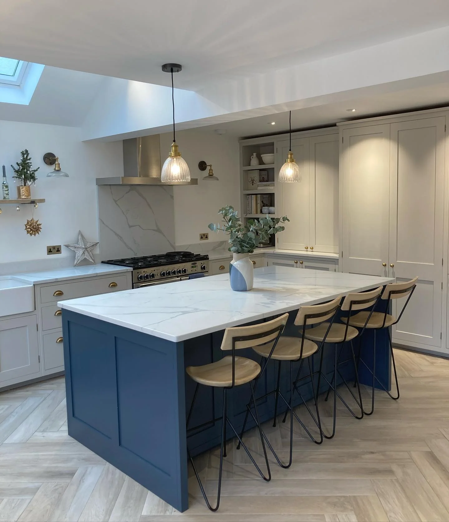 Paneled Blue Island Grounds Kitchen with Light Grey Cabinetry