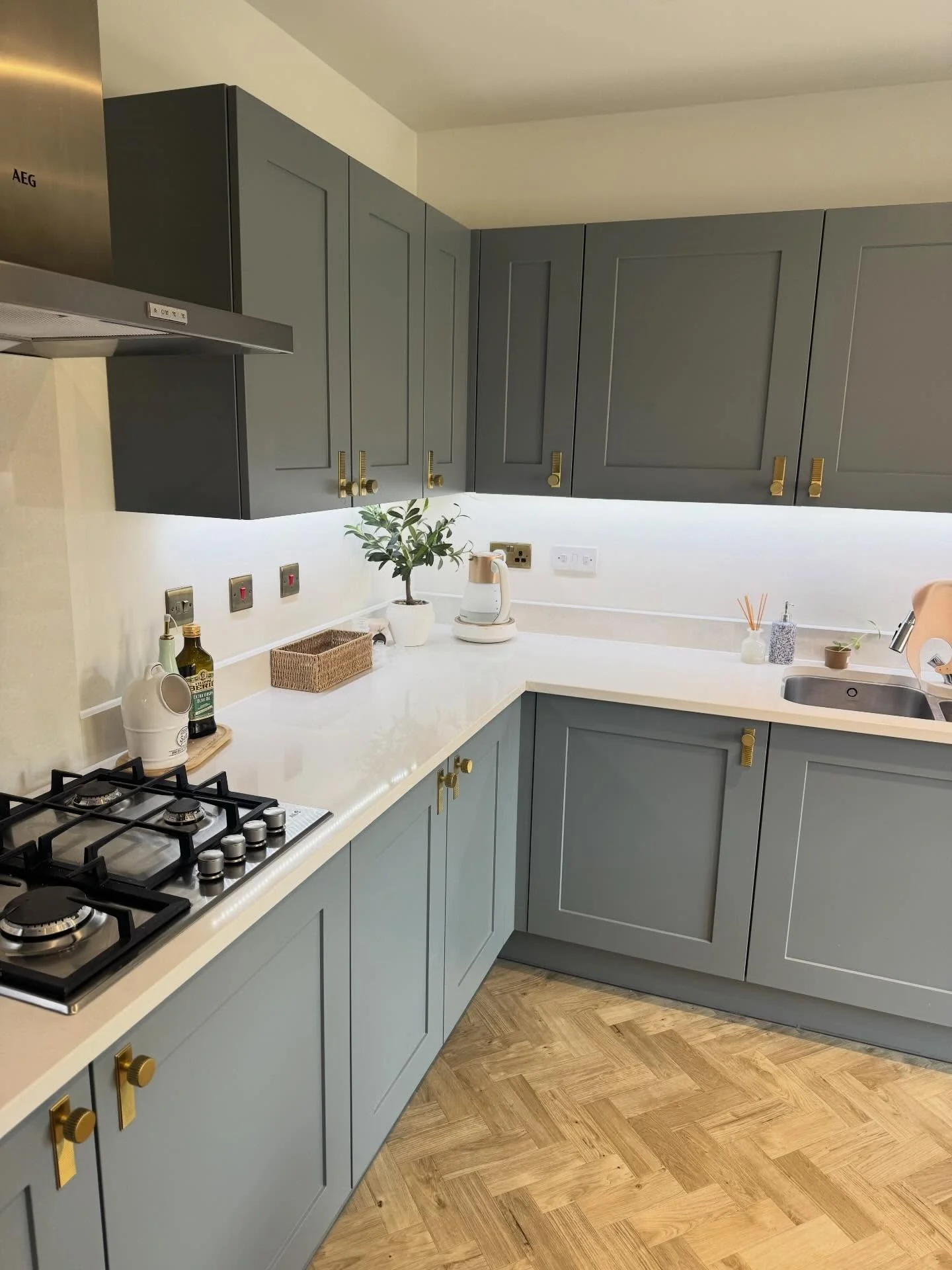 Brass Bar Pulls Add a Warm Touch to Grey Cabinetry