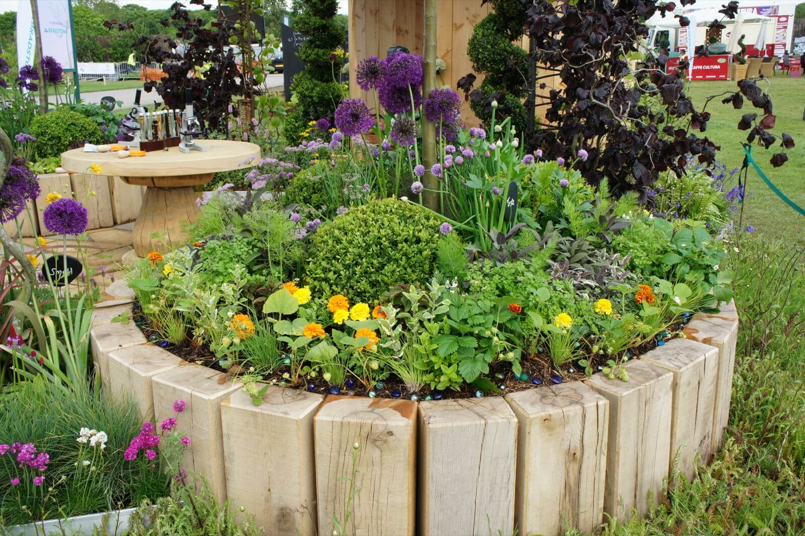 Log Edging Creates a Rustic Raised Flower Bed