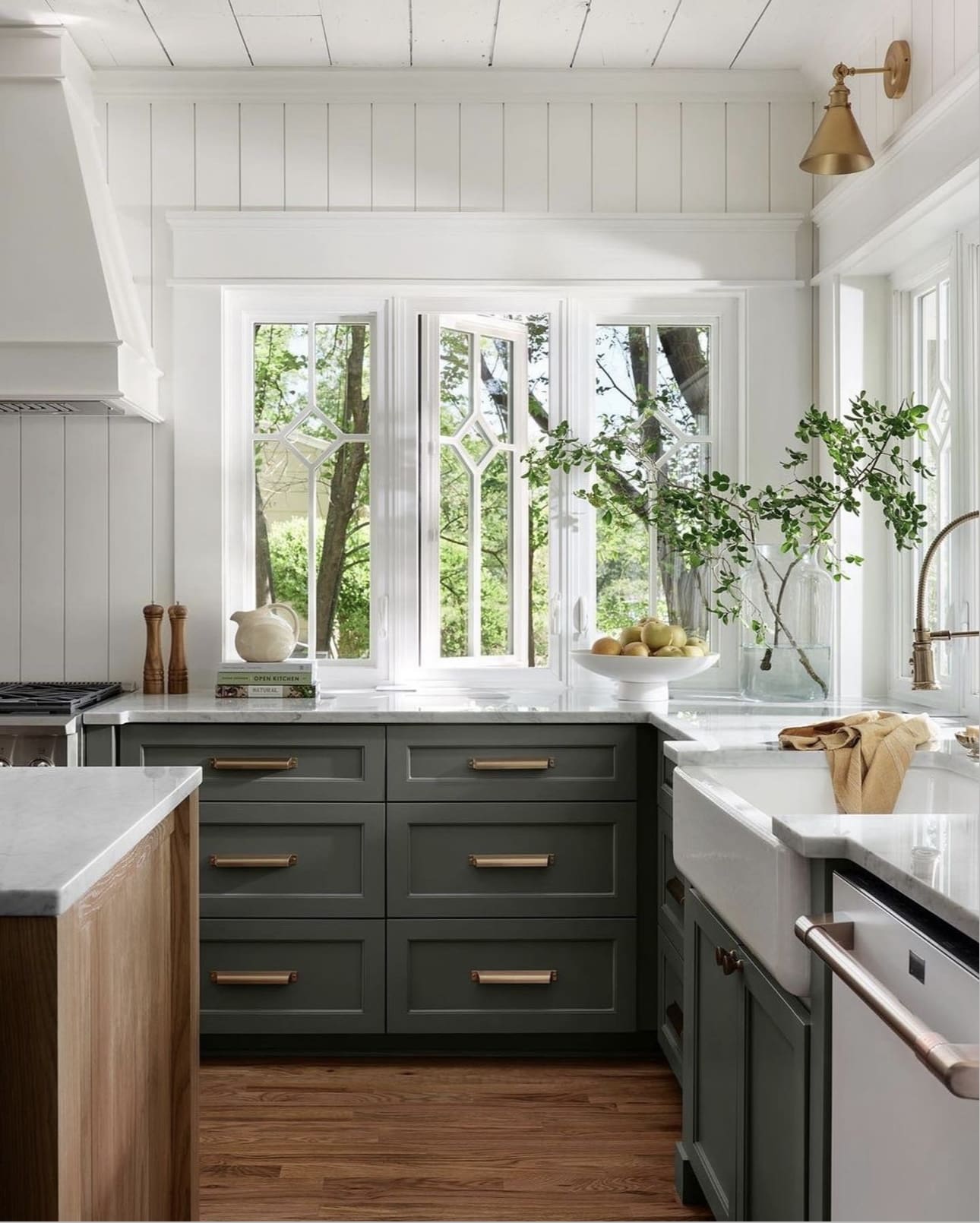Green Kitchen Cabinets with Brass Hardware and Marble Countertops