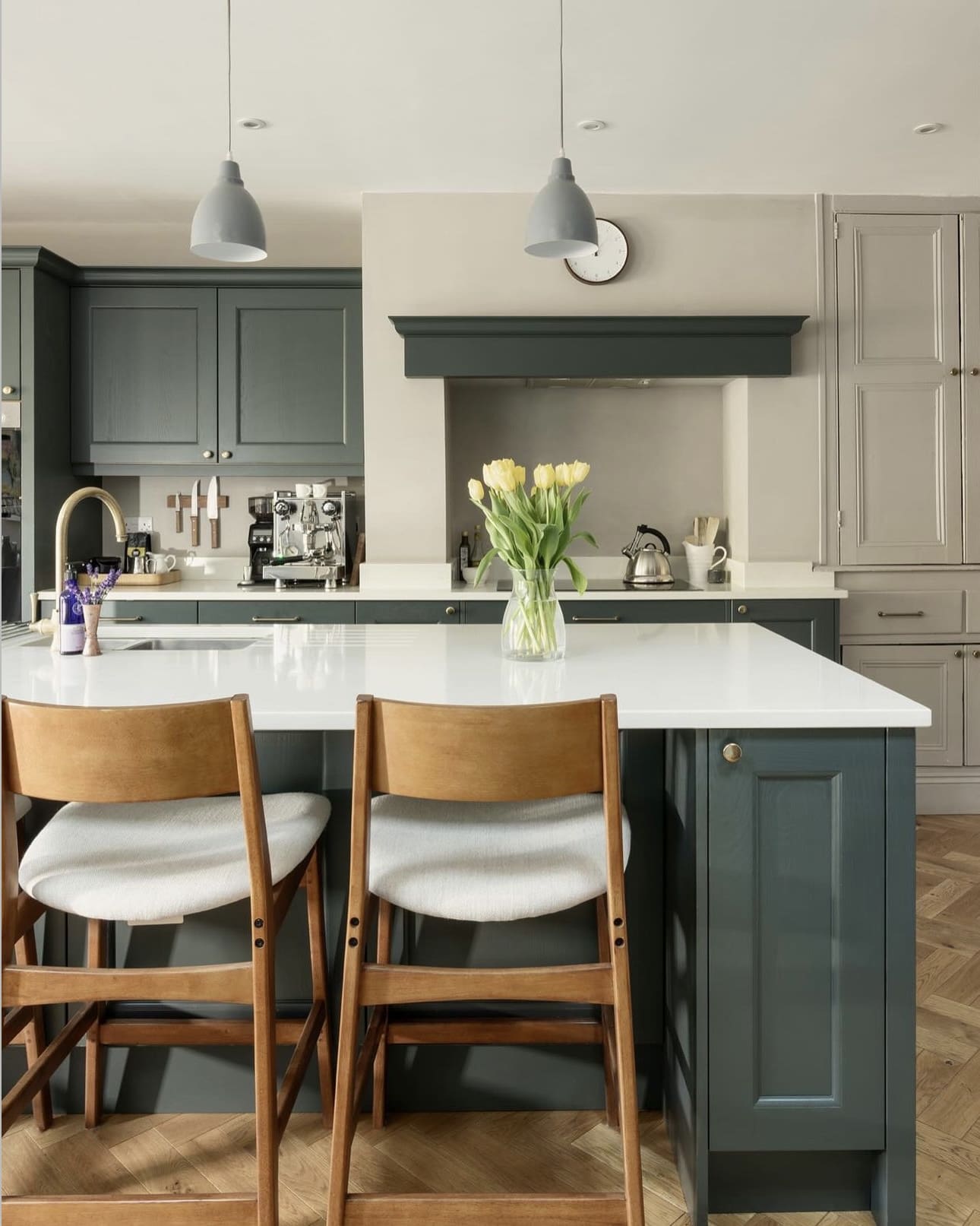 Dark Green Island Cabinets Anchor the Kitchen's Color Palette