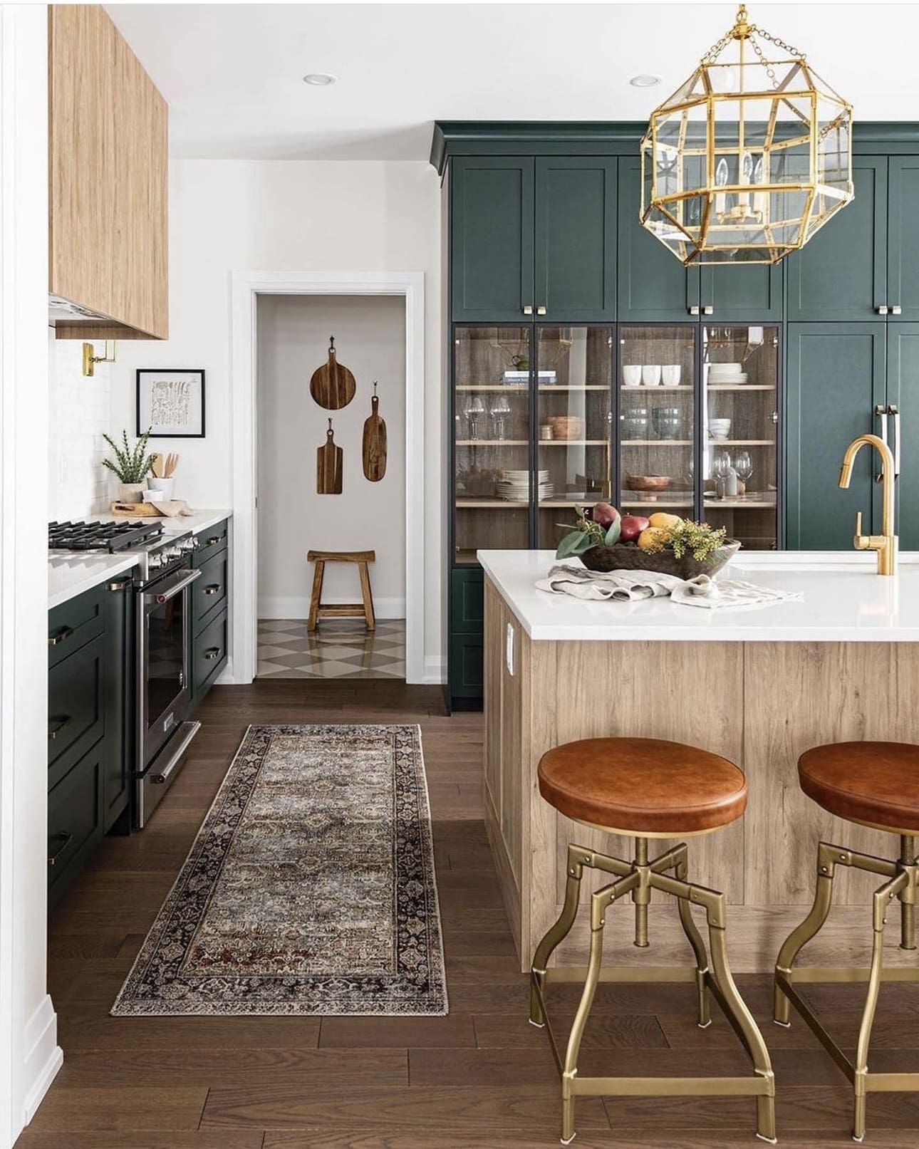 Glass-fronted cabinets display dishware and glassware