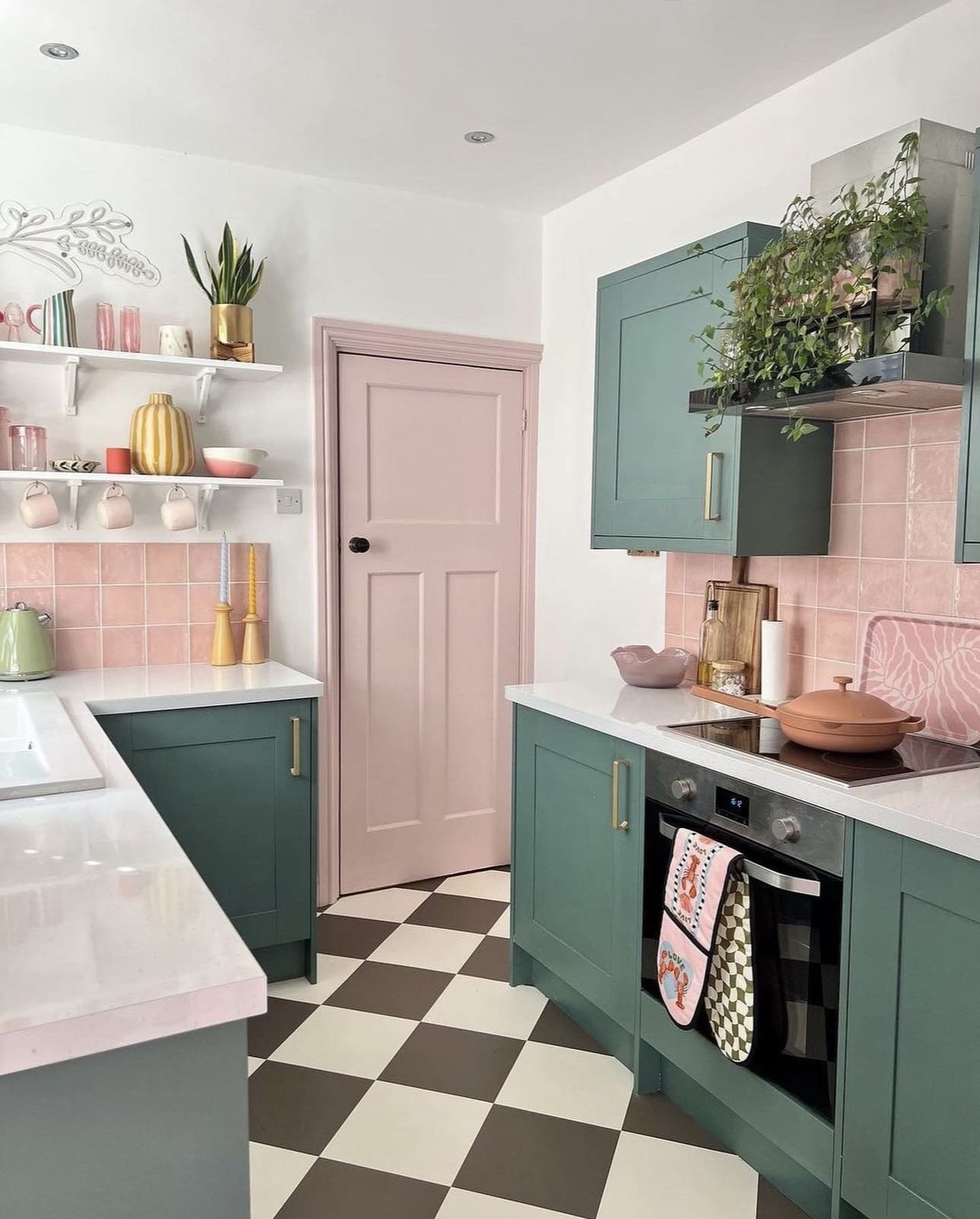 Checkerboard Floors Add Playful Contrast to Dark Green Kitchen