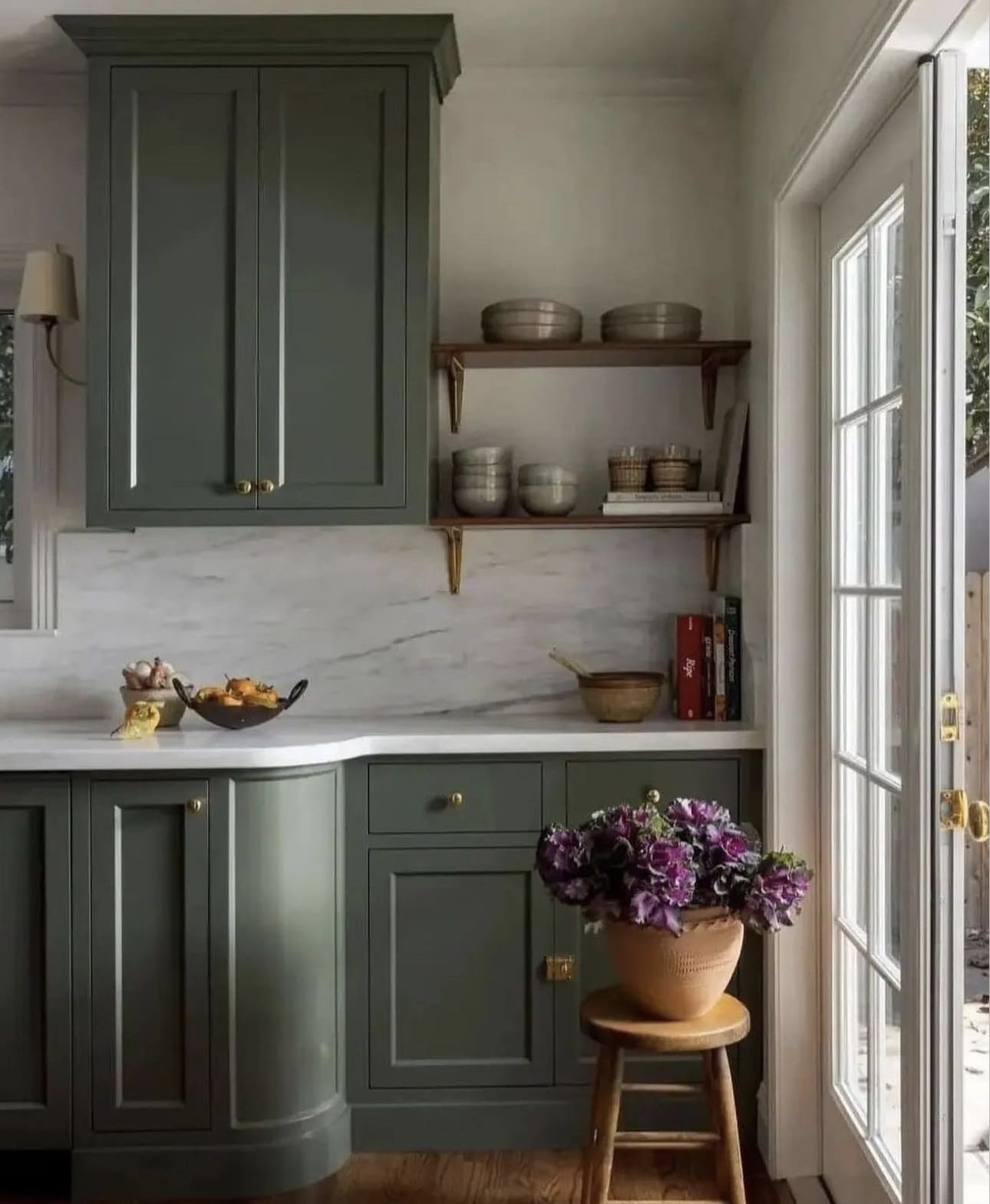 Dark Green Cabinets With Marble Backsplash and Open Shelving
