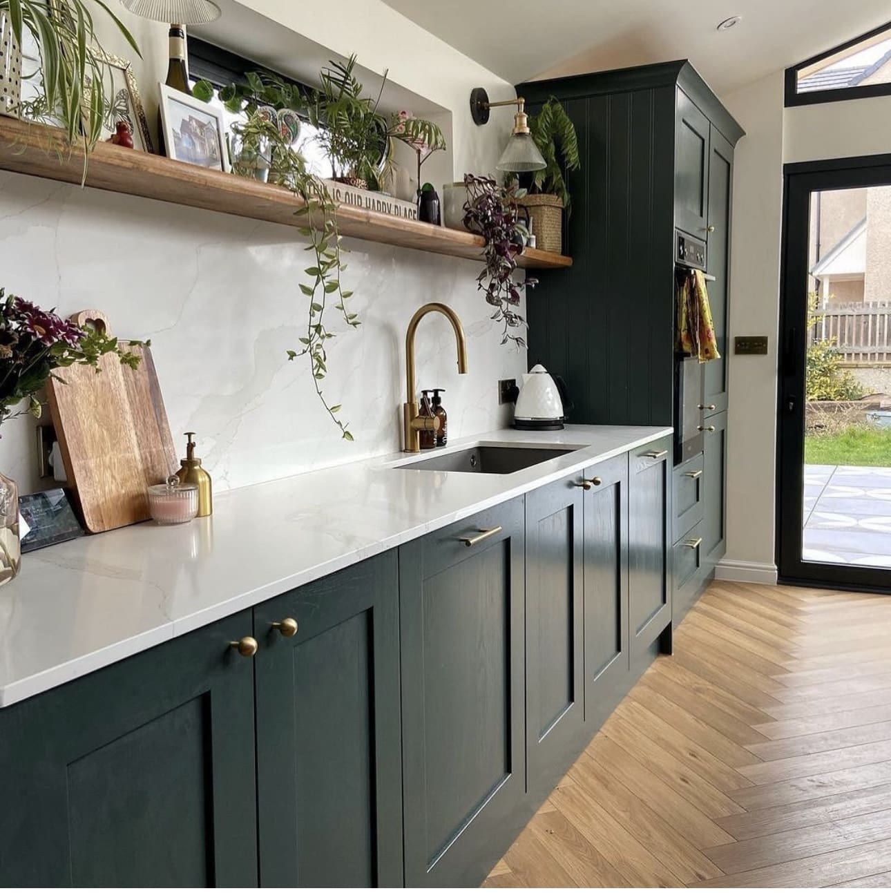 Dark Green Shaker Cabinets With Warm Brass Hardware