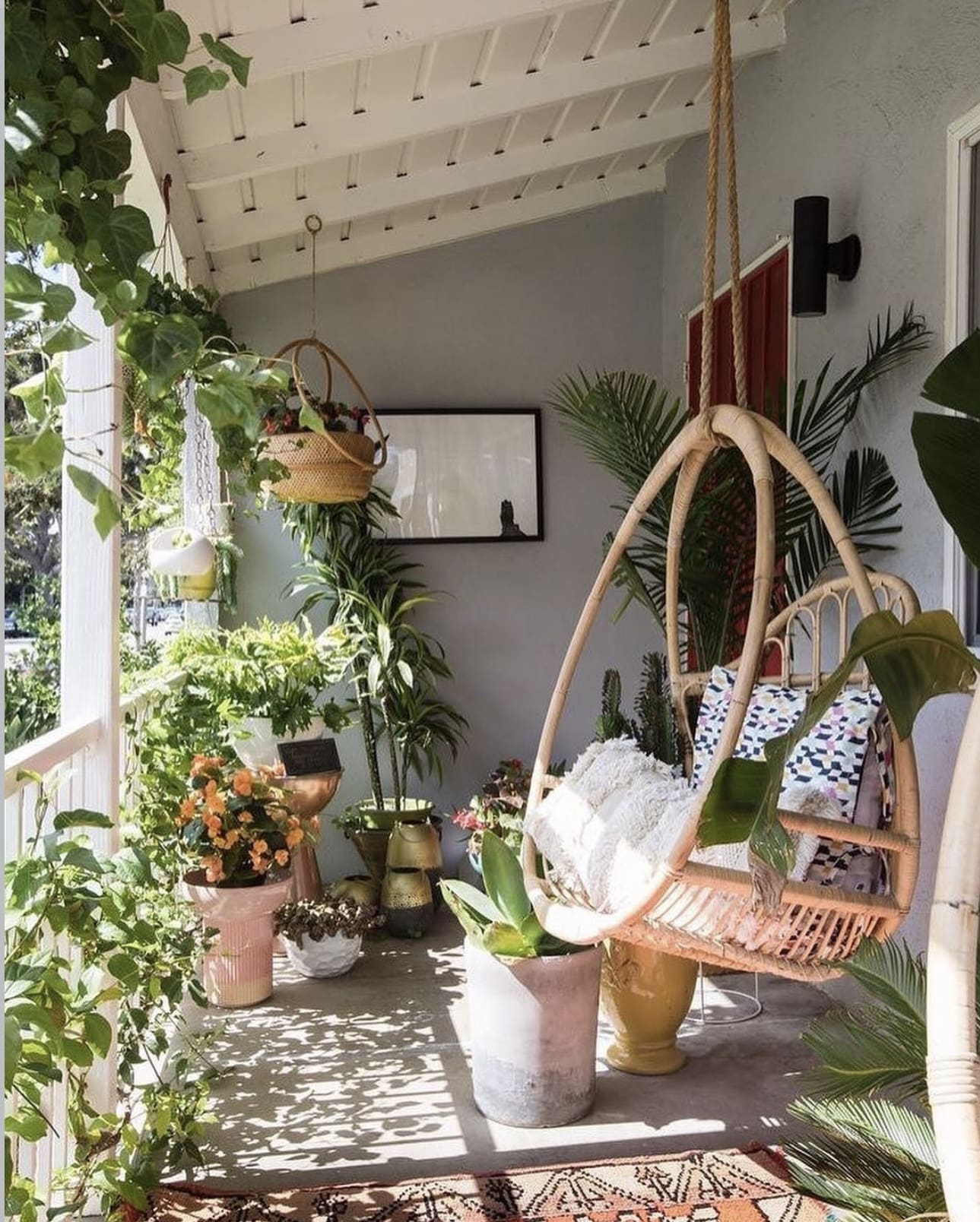 Woven Hanging Chair With Patterned Cushions for Boho Vibes