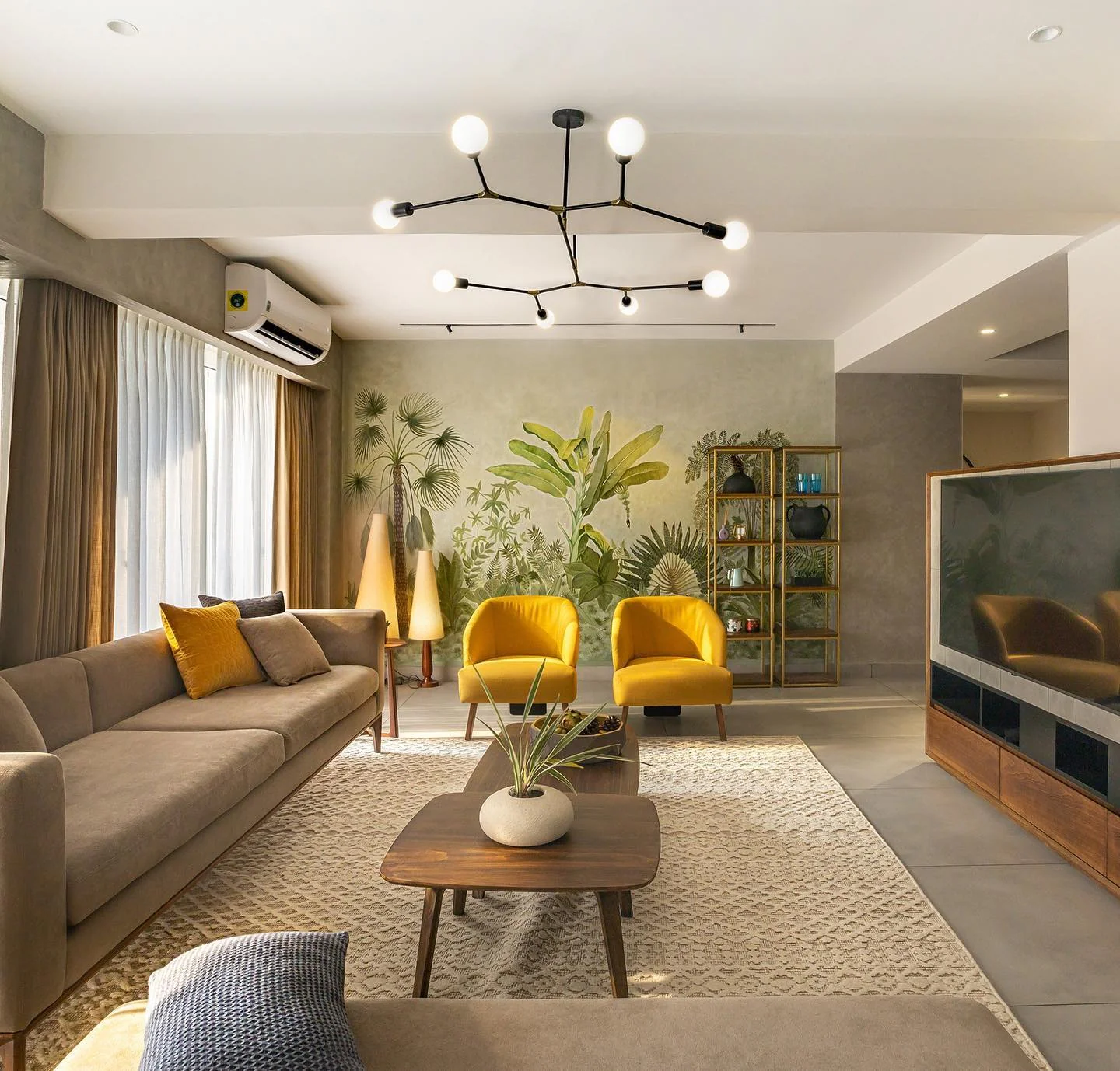 Botanical Mural Creates a Lush Jungle Escape Behind Yellow Chairs