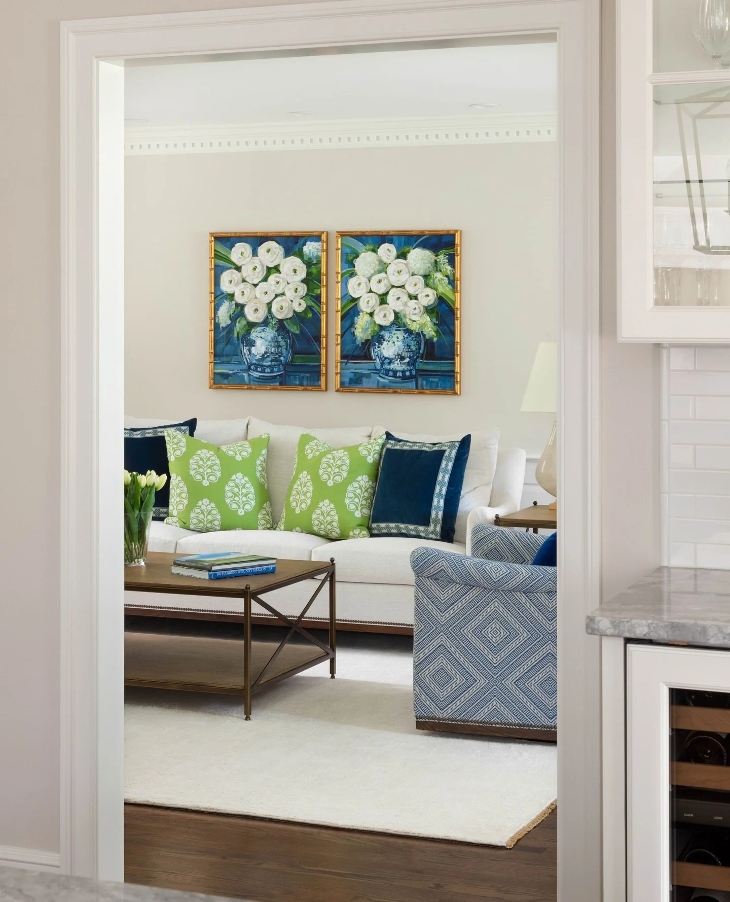 Pair of Floral Paintings Adds Vivid Color Above Sofa