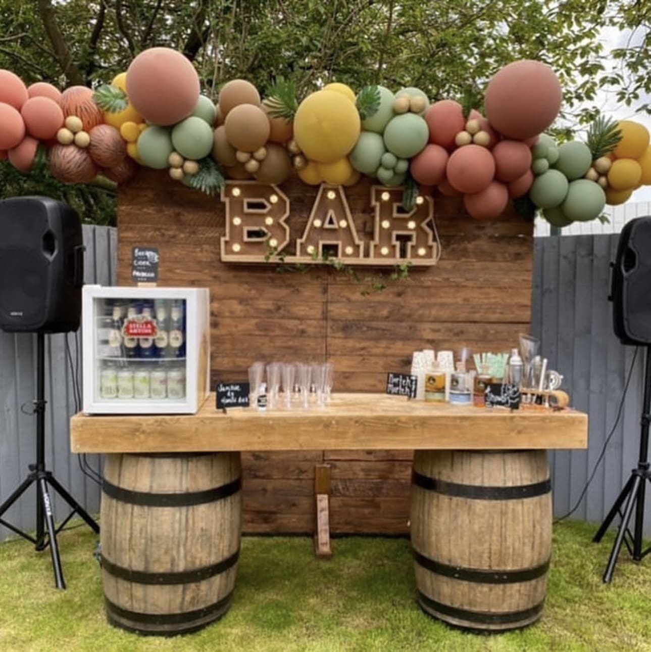Rustic Barrel Bar Supports a Two-Tiered Drink Station