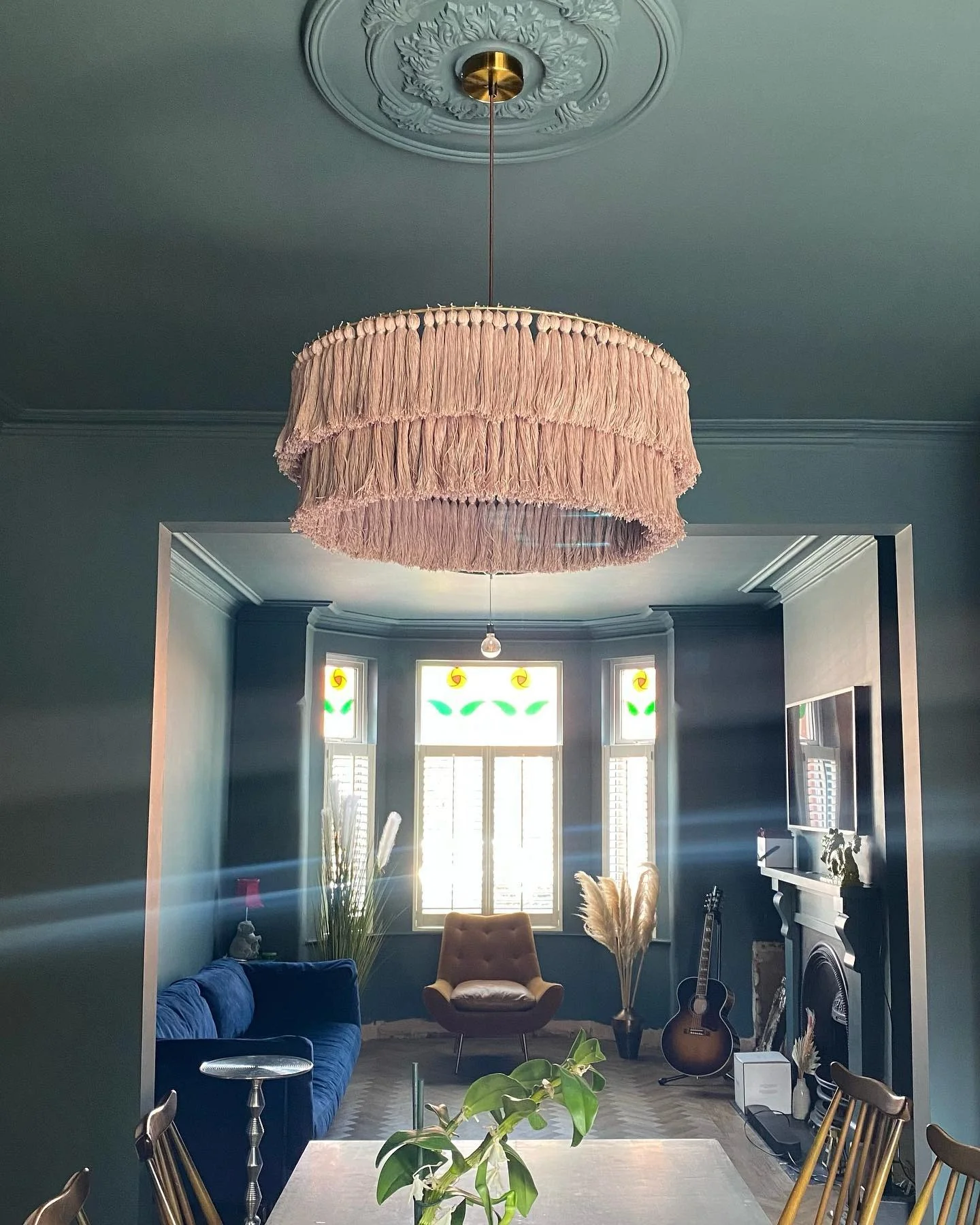 Tassel Chandelier Adds Bohemian Flair to Dark Walls
