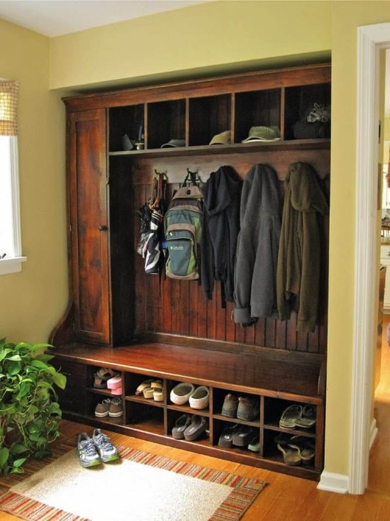 Wood slat backboard creates a classic coat hook wall