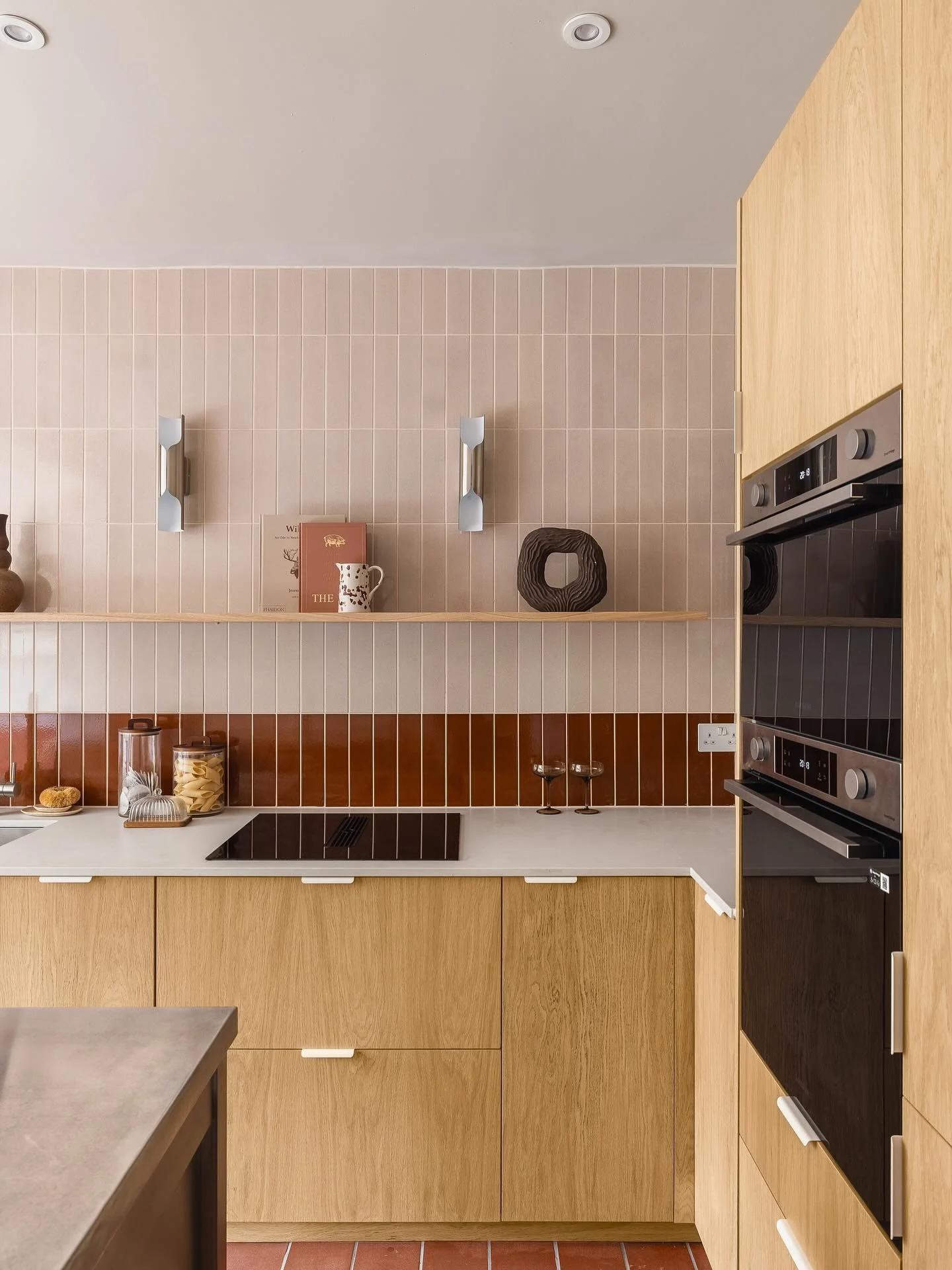 Two-tone tile backsplash adds visual depth