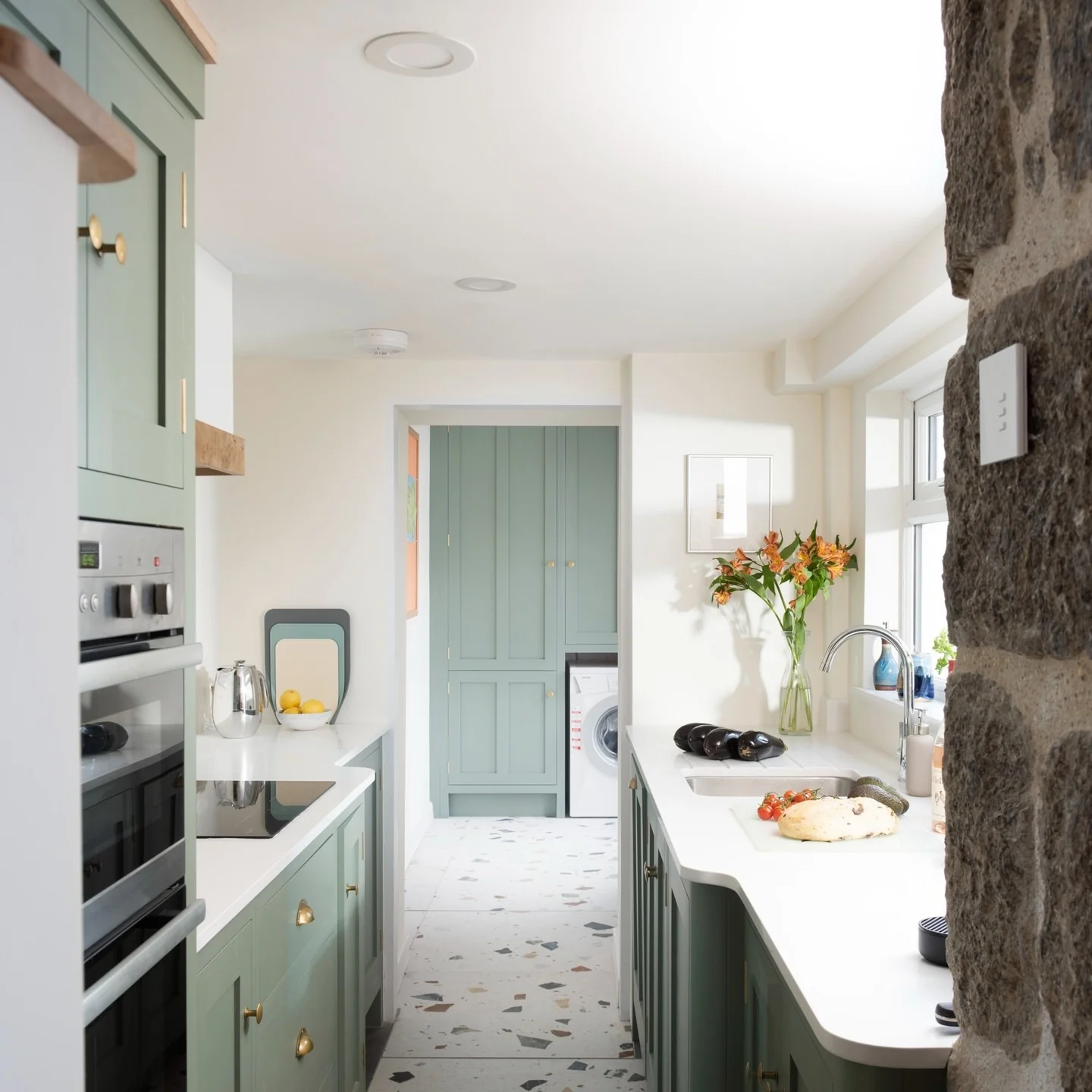 Rounded cabinet edges soften the kitchen