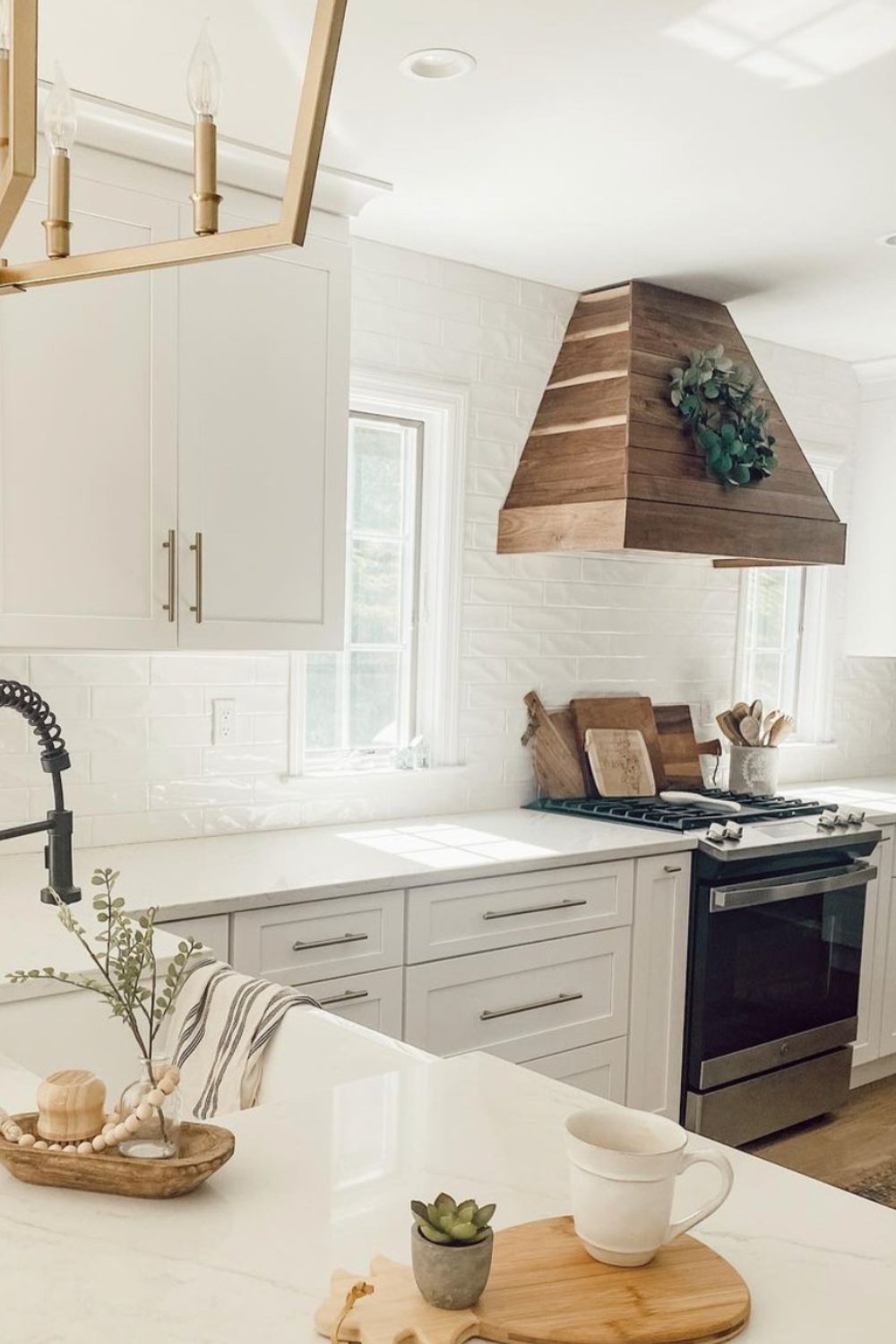 Wood Plank Range Hood With A Greenery Accent