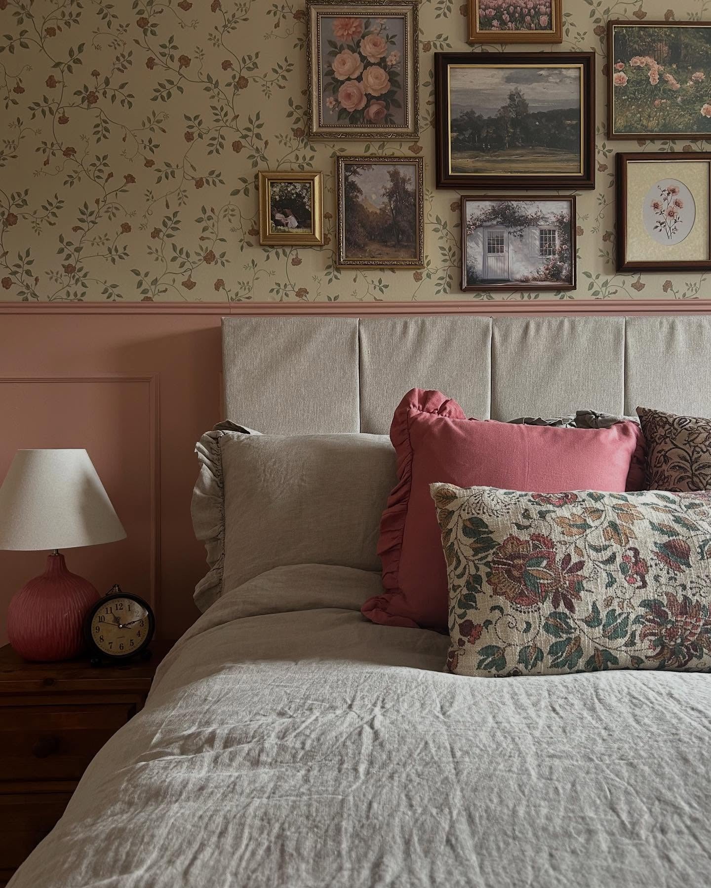 Gallery Wall of Vintage Art Above Headboard
