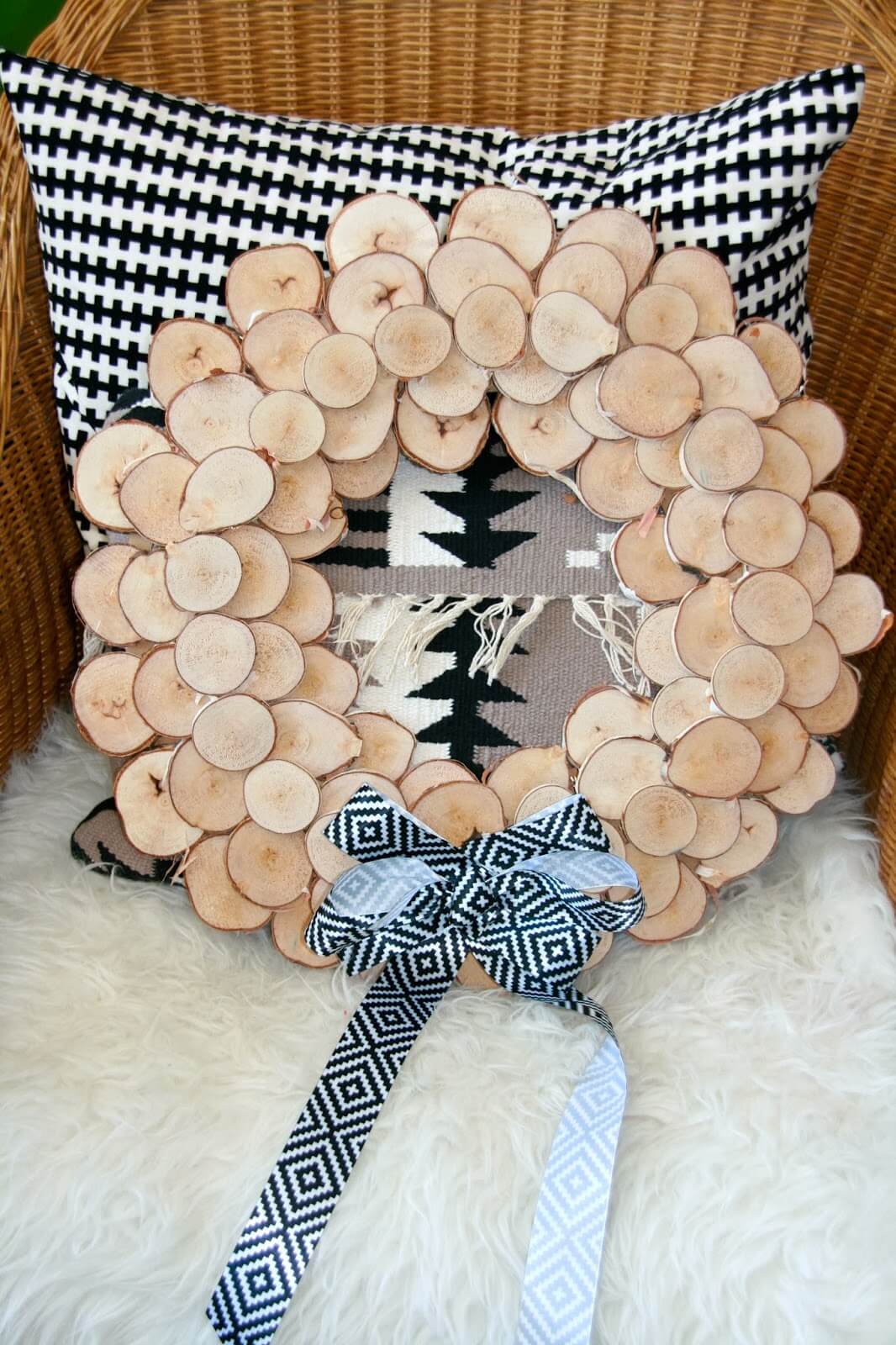 Wood Slice Wreath With Geometric Bow Accent