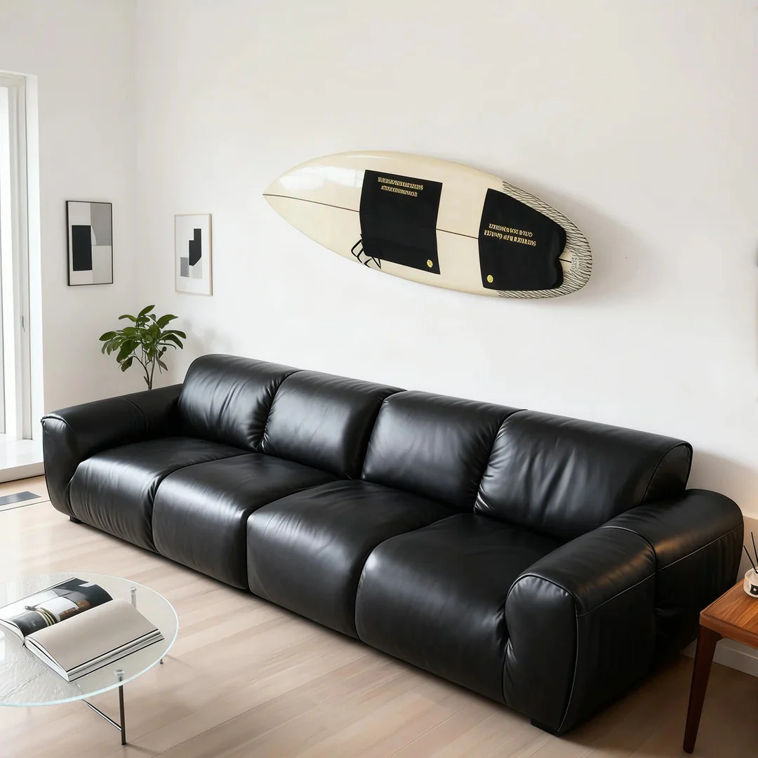 Surfboard Art Adds Coastal Vibe Above Black Seating