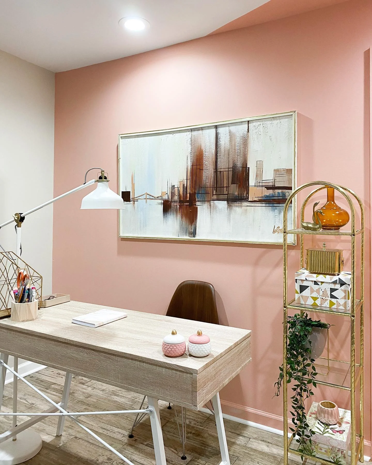 Gold tiered shelving unit for decorative storage