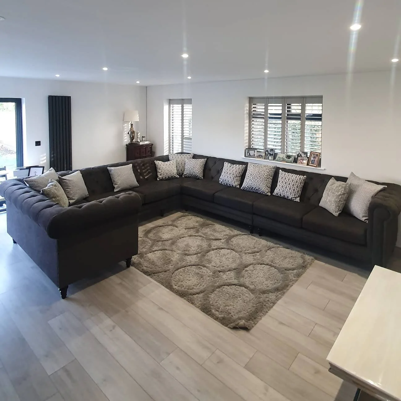 Tufted Charcoal Sectional Sofa with Geometric Patterned Pillows