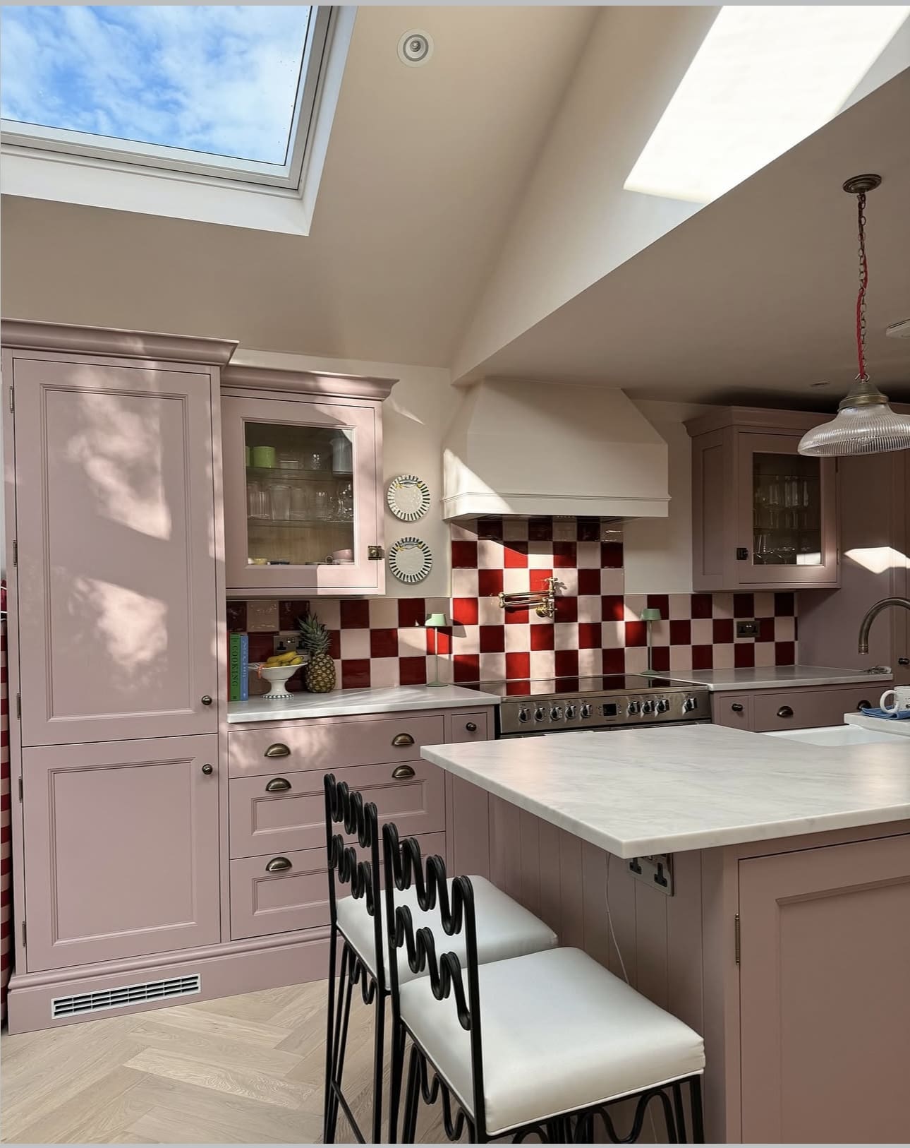 Red and White Checkerboard Backsplash Adds Graphic Punch to Pink Cabinets