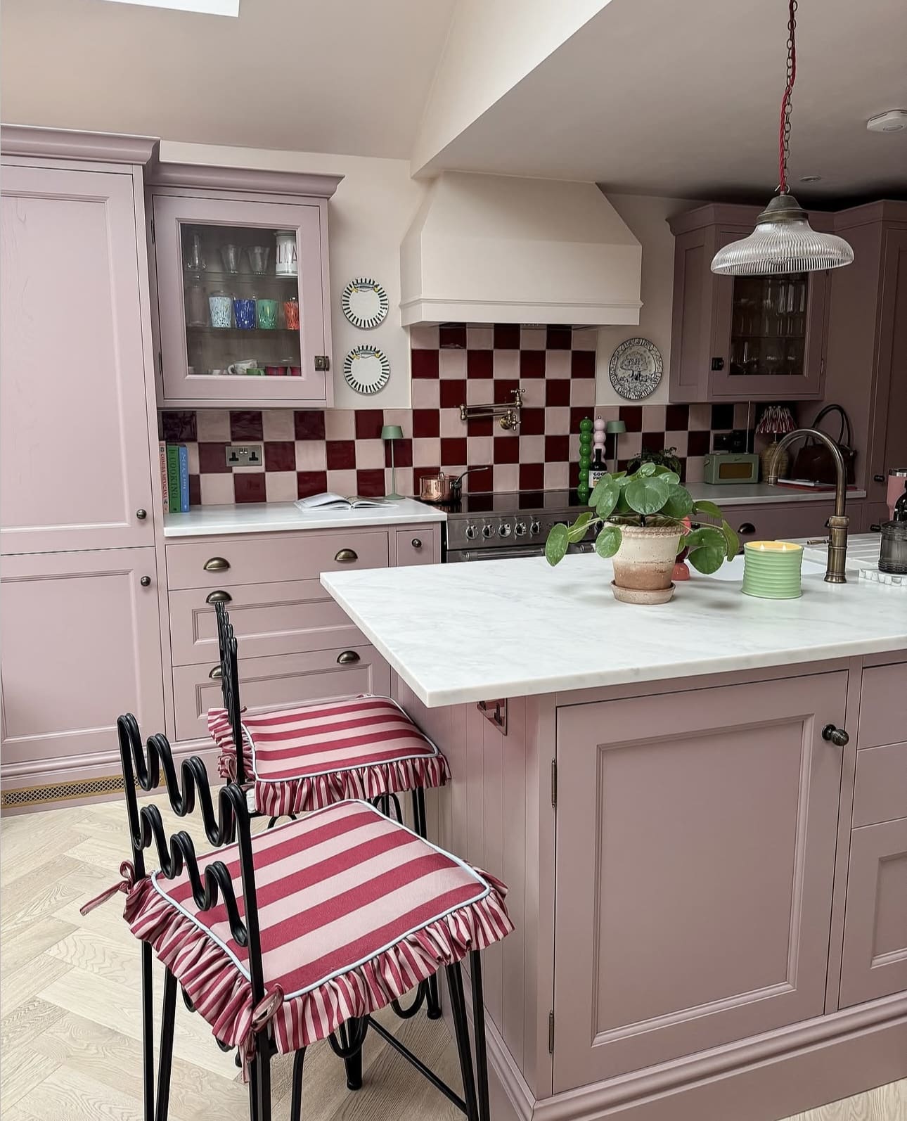 Striped Bar Stools Add Playful Pattern to Pink Island