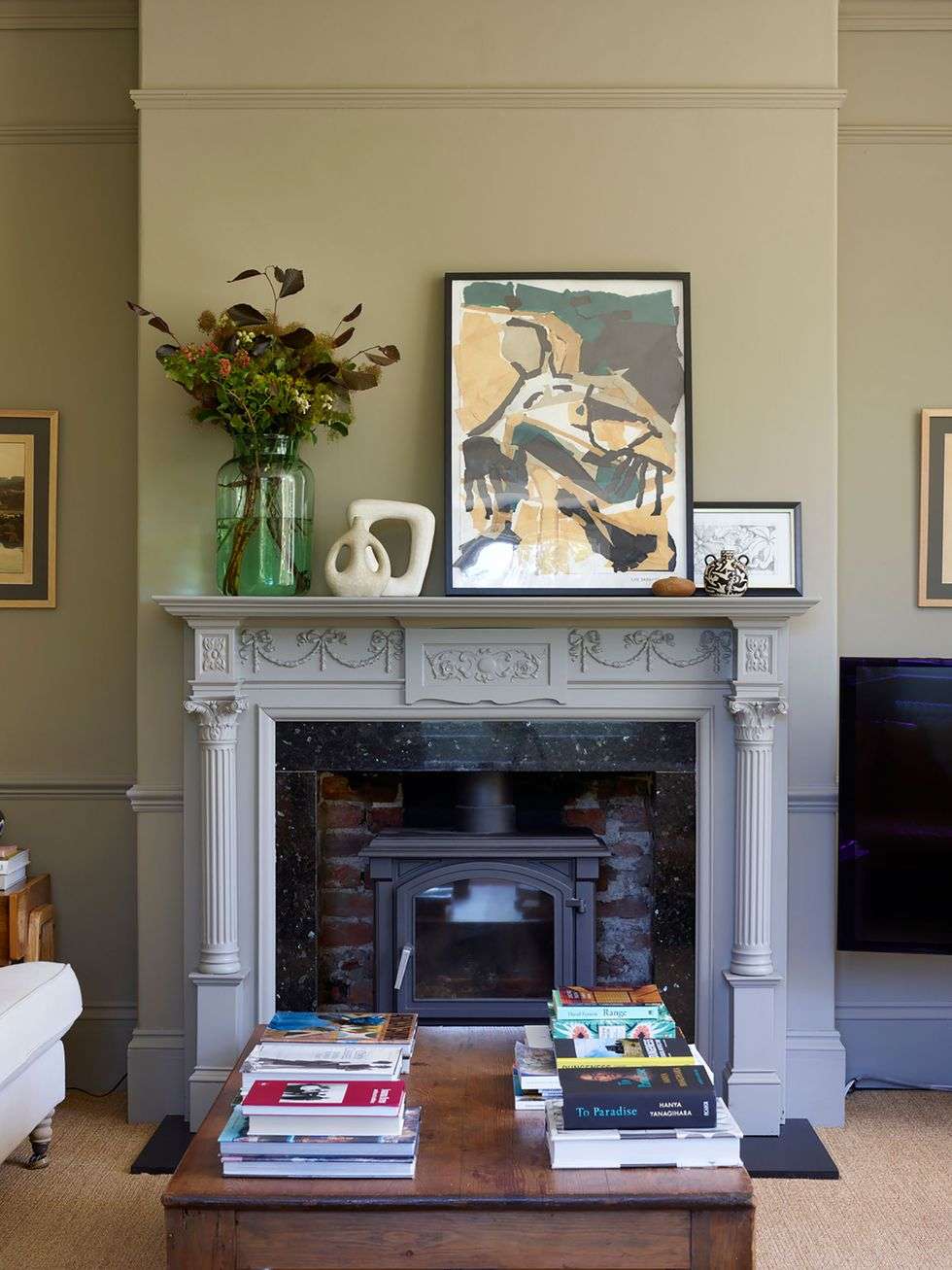 Oversized Abstract Art Anchors a Sage Green Mantel