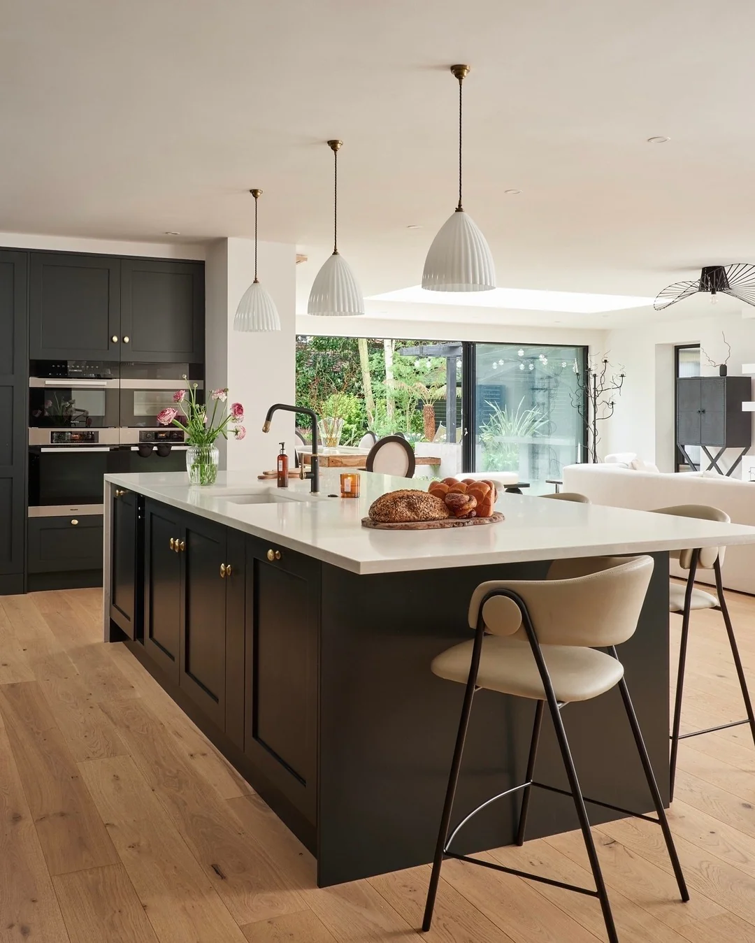 Ribbed White Pendant Lights Add Soft Illumination Above Island