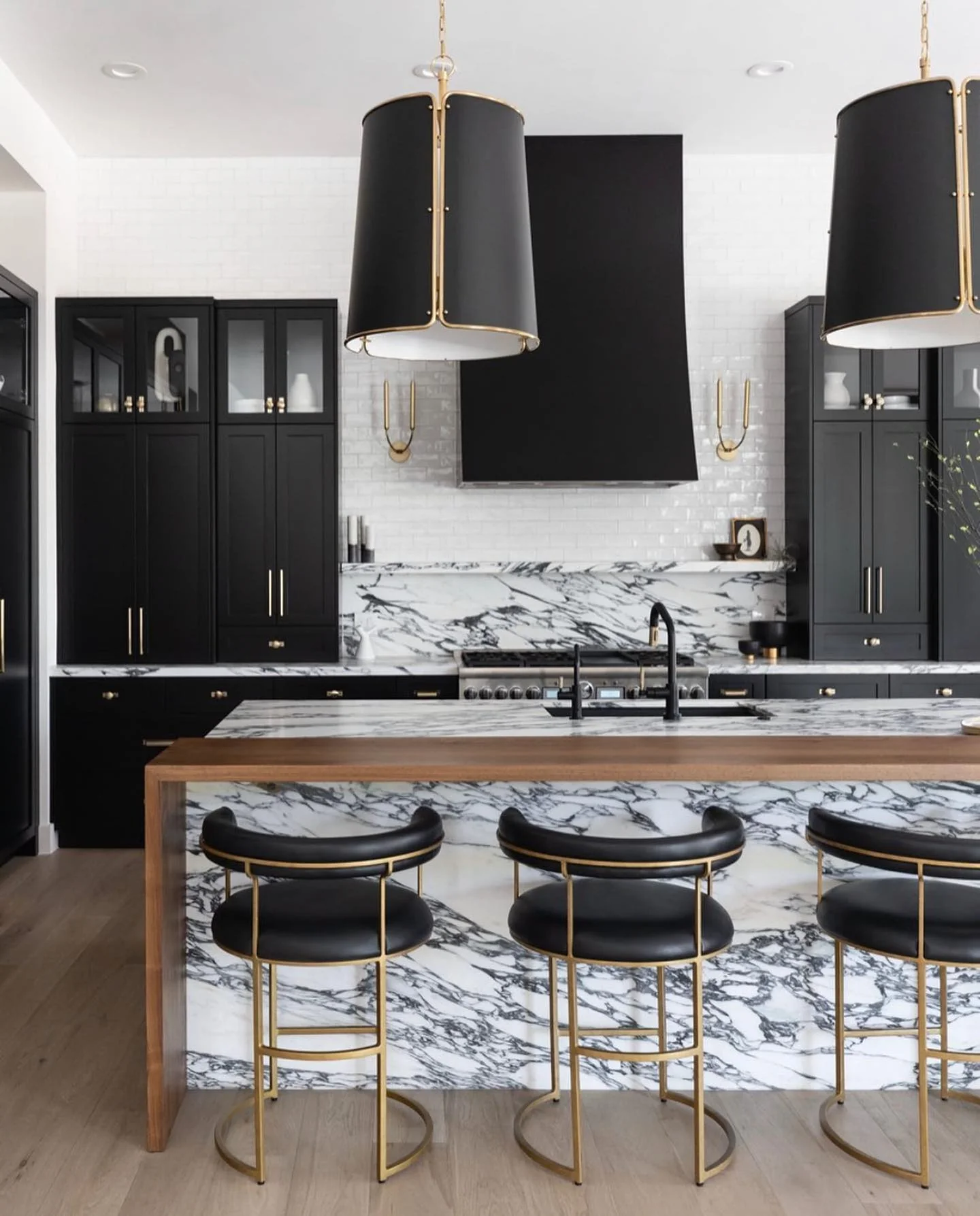 Contrast Marble Waterfall with Wood Countertops