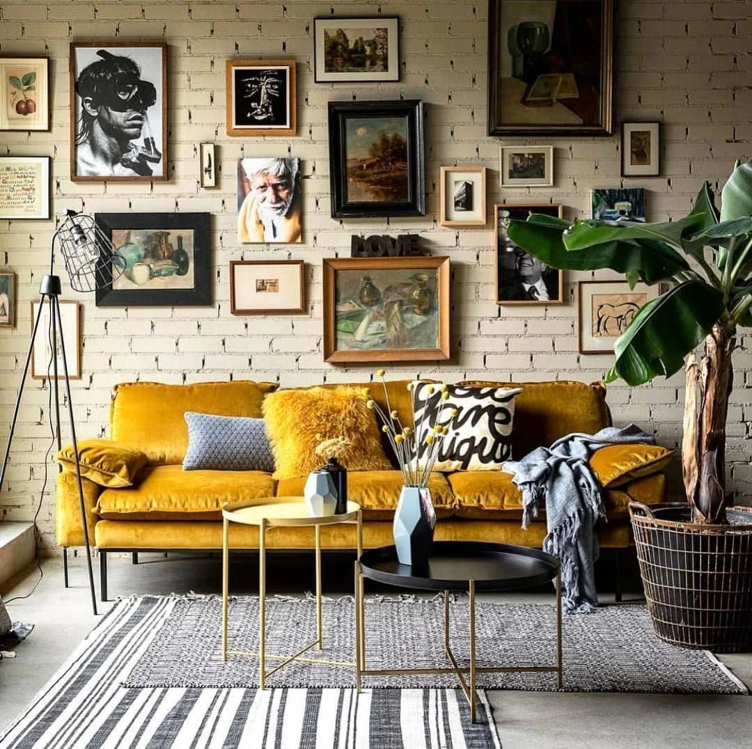 Gallery Wall of Eclectic Art Mixes Yellow and Green Tones