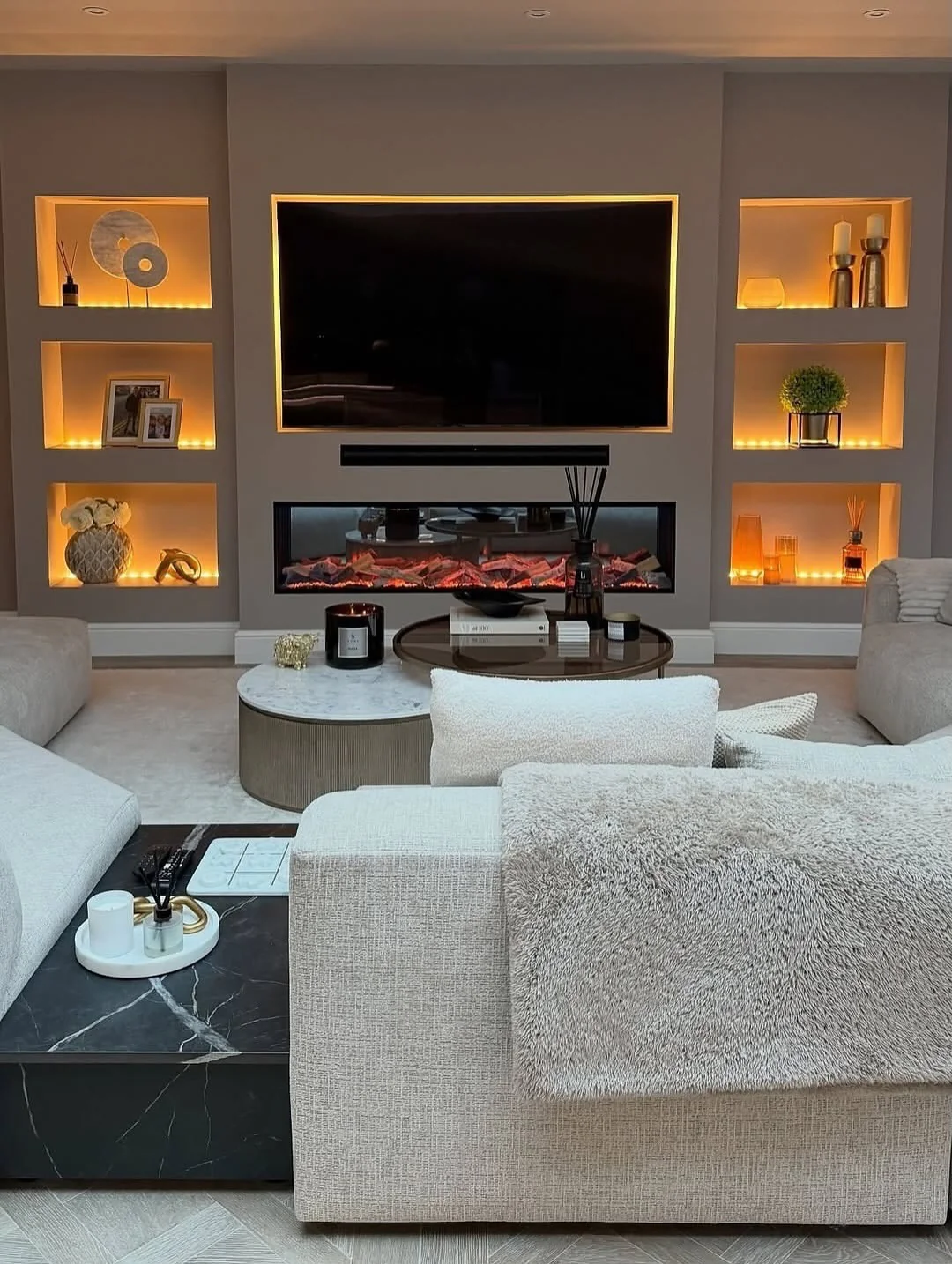 Recessed Niches With Integrated Lighting Create Cozy Display Zones