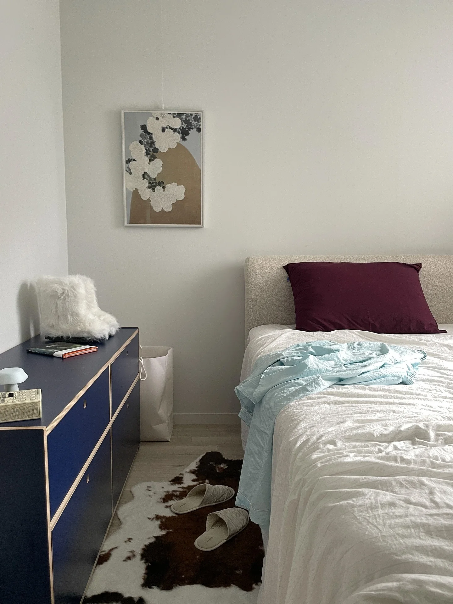 Deep navy modular drawers add a graphic punch to small spaces