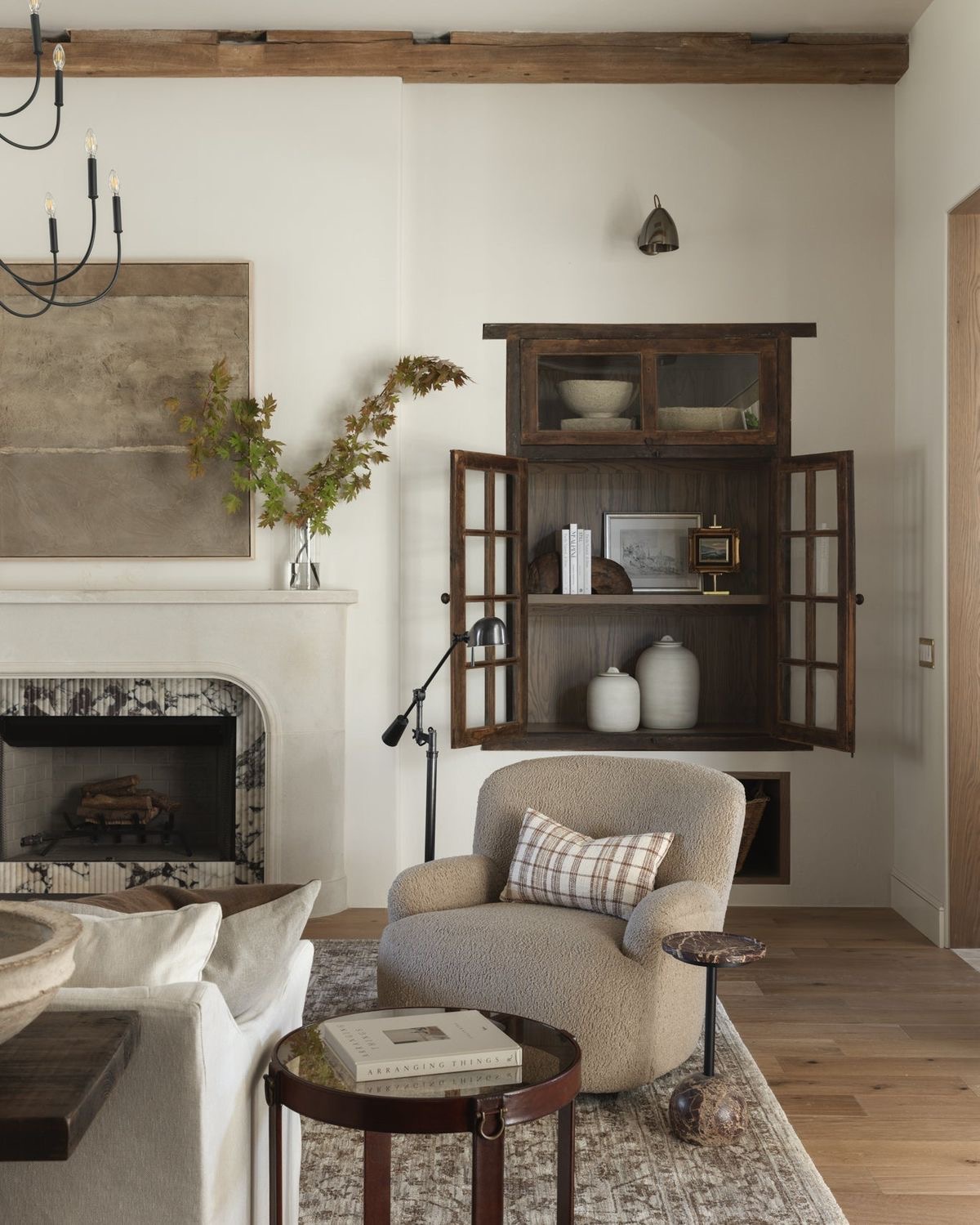 Dark Wood Cabinet With Glass Doors Displays Curated Decor