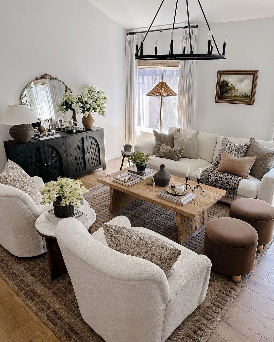 Pair a Round Mirror with an Ornate Frame Above a Dark Cabinet