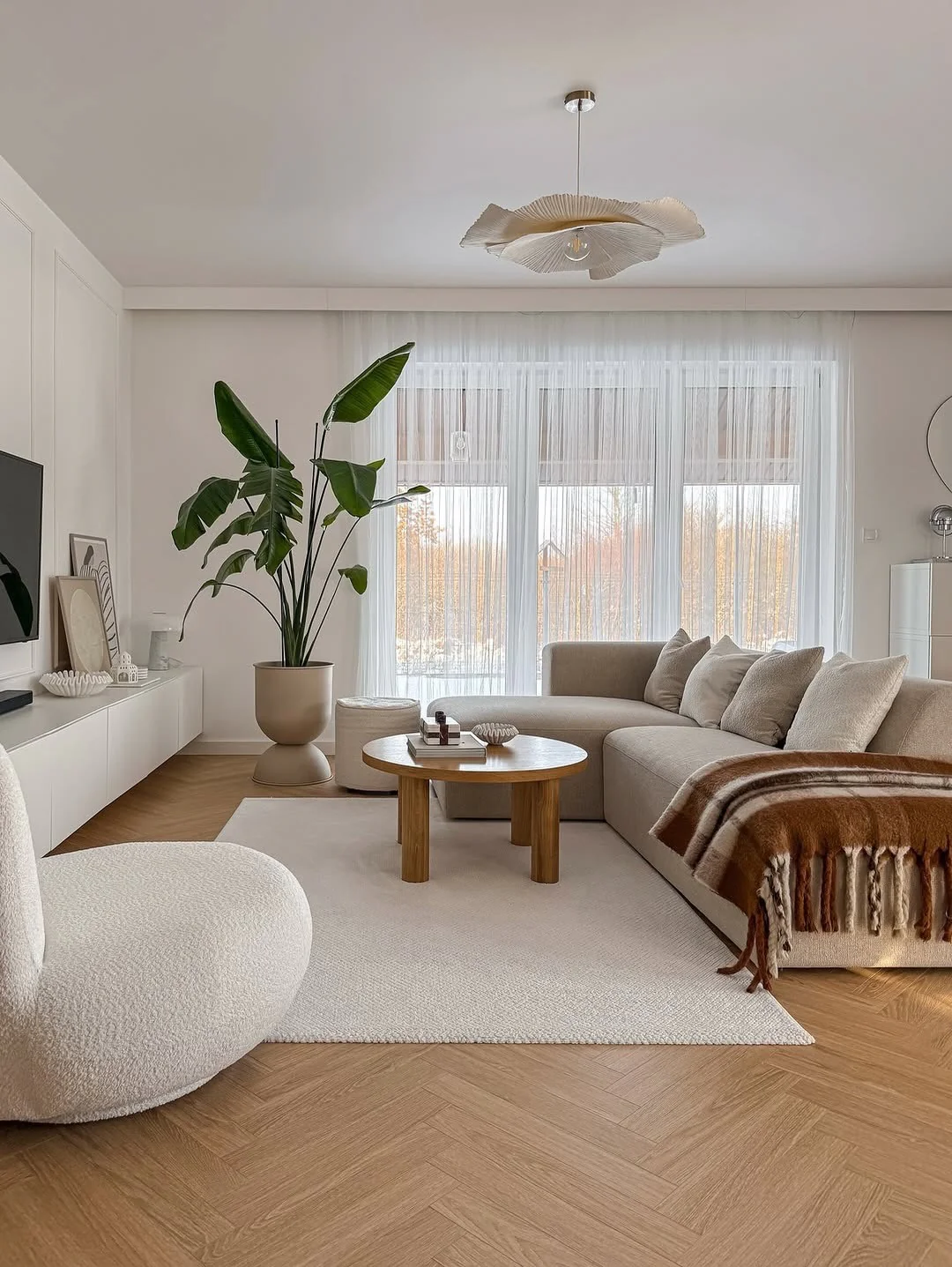 Fluted Pendant Light Adds Organic Texture Above the Sofa