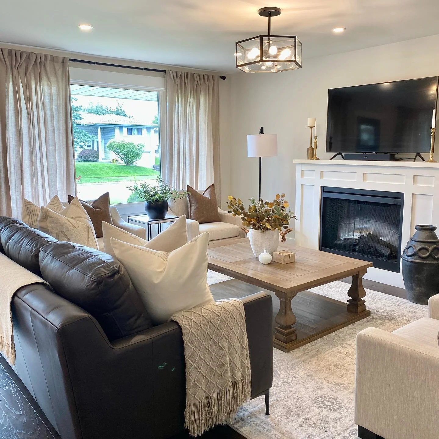 Neutral Patterned Rug Grounds the Cozy Seating Arrangement