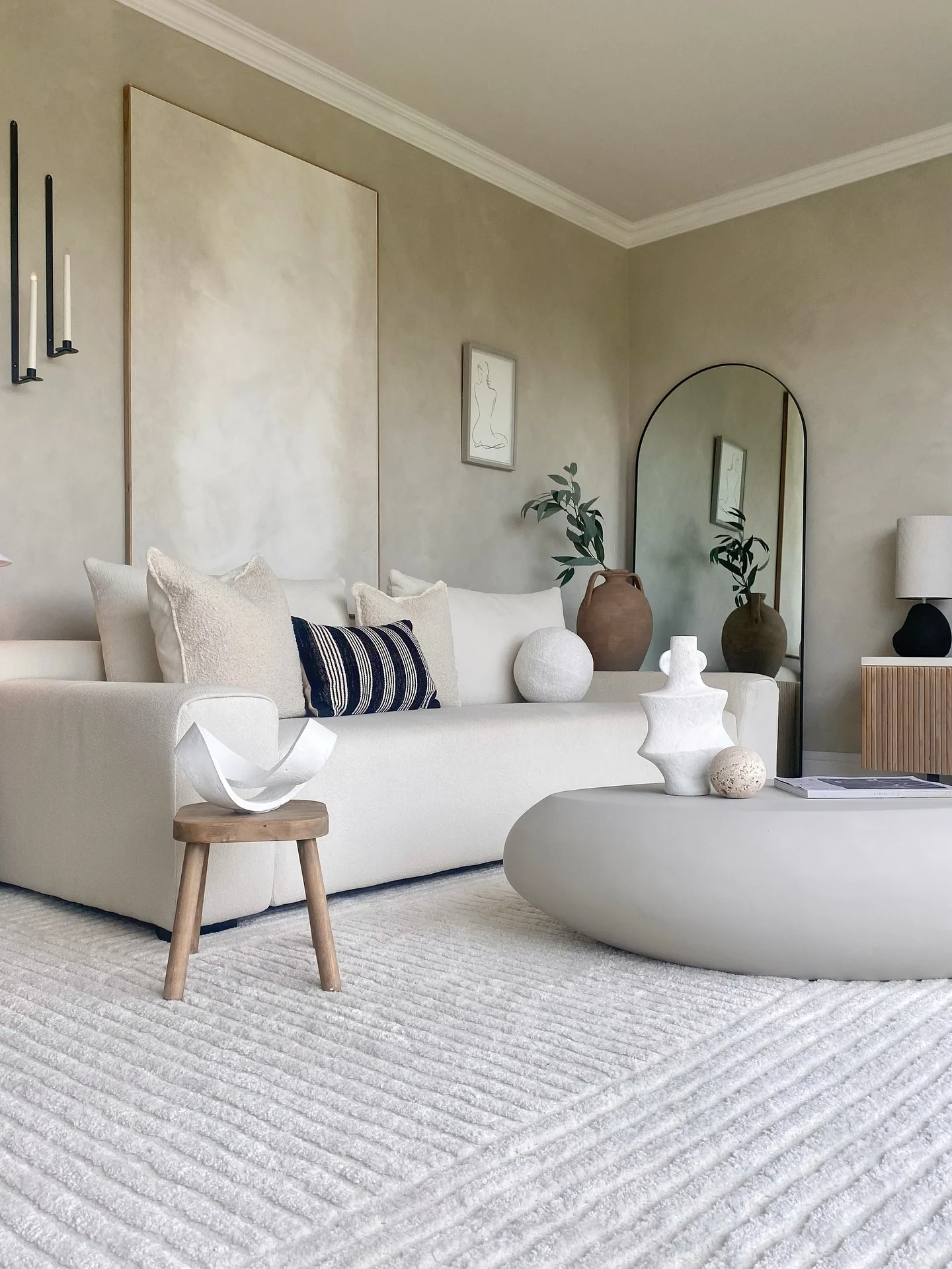 Oversized Textured Artwork Anchors the Serene Neutral Palette