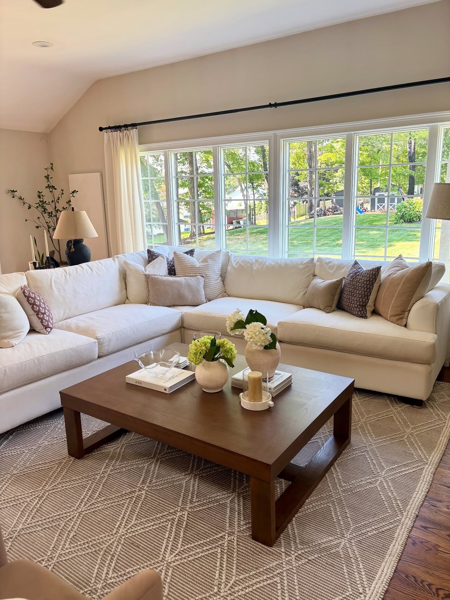 Textured Neutral Rug Grounds the Sectional Sofa