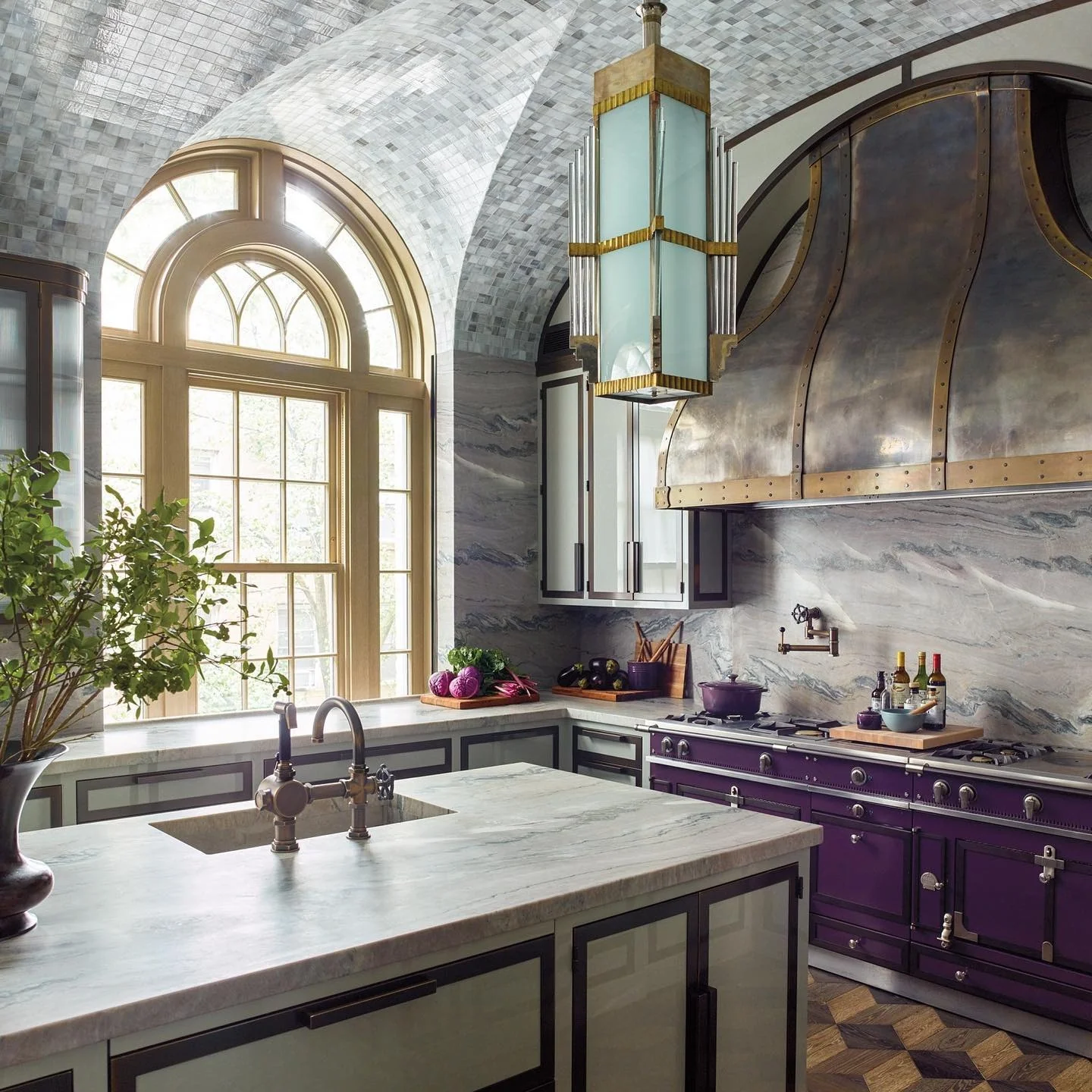 Deep Plum Range Grounds a Marble and Tile Kitchen