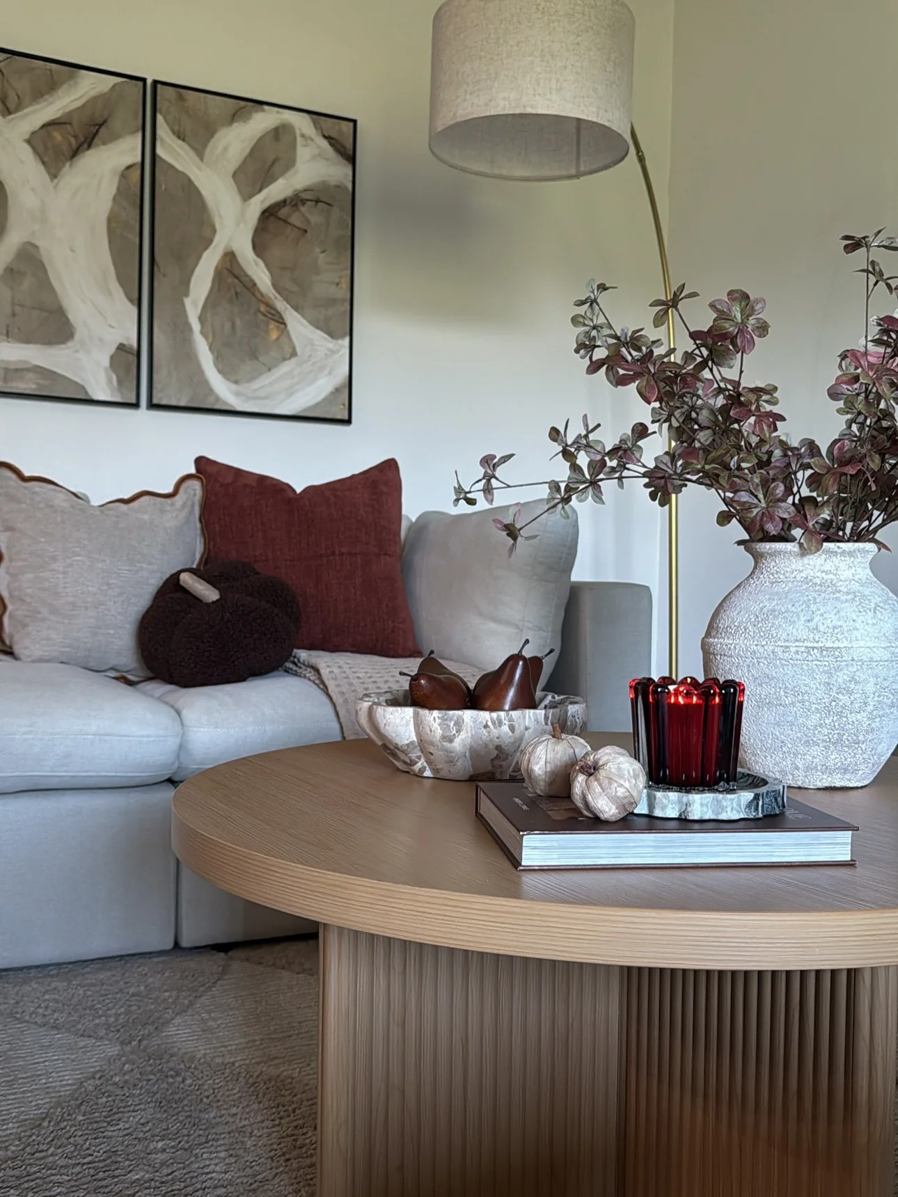Combine Textured Vases and Red Candles for Ambiance