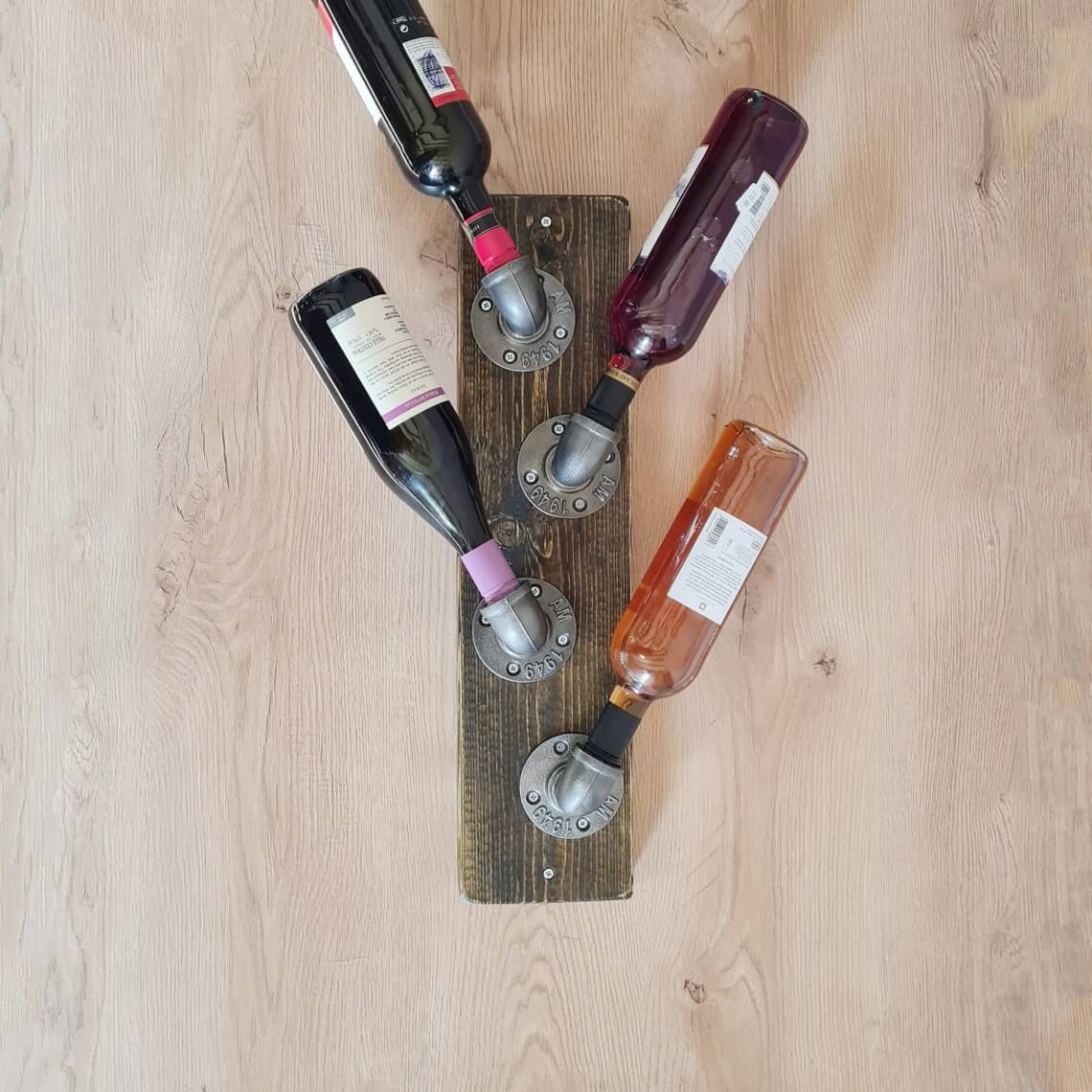 Angle Bottles on Wood with Industrial Pipe Fittings