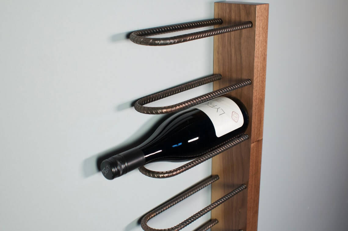 Rebar Loops Secure Bottles on a Wooden Back Panel