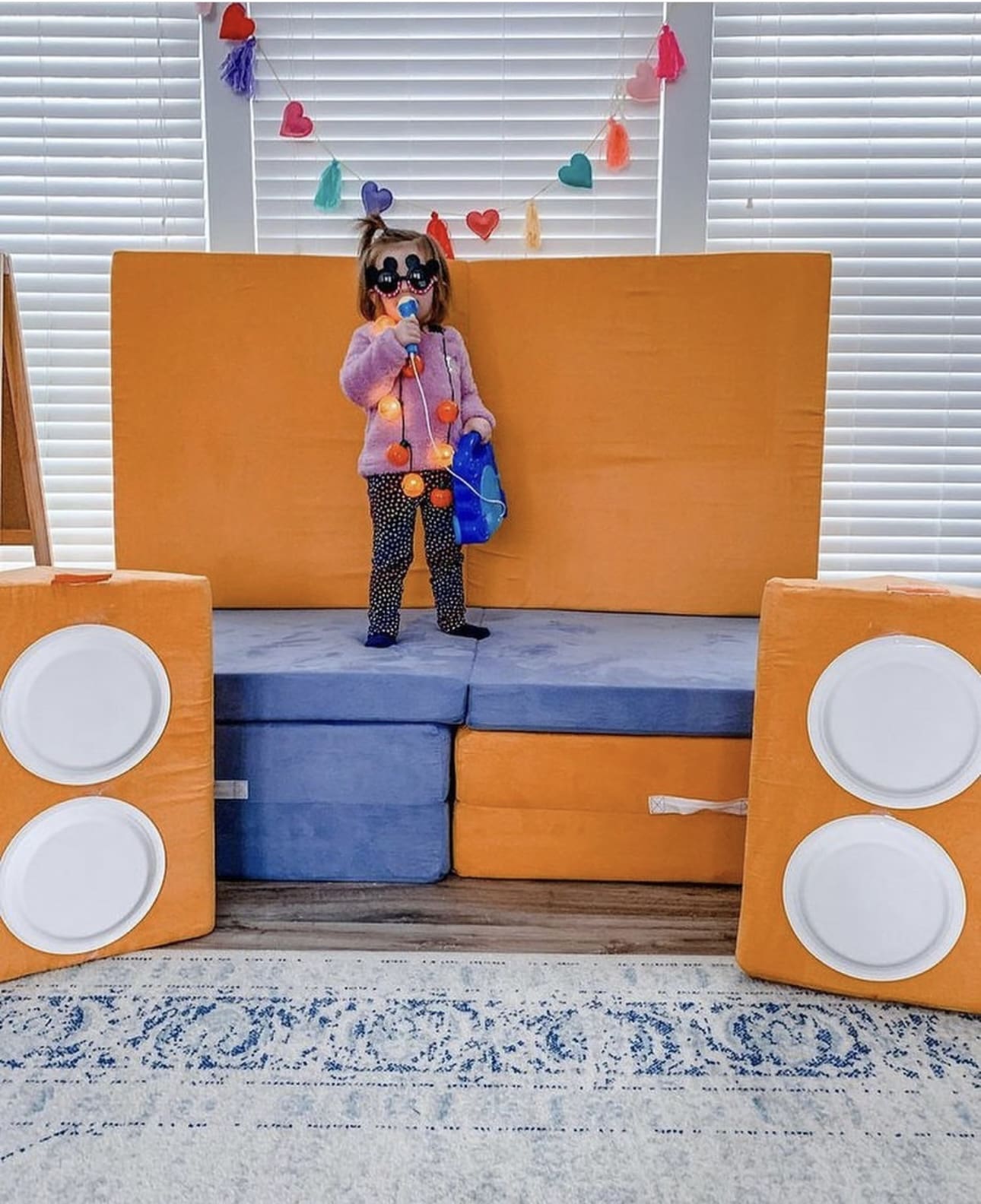 DIY Speaker Towers Frame a Nugget Couch Stage
