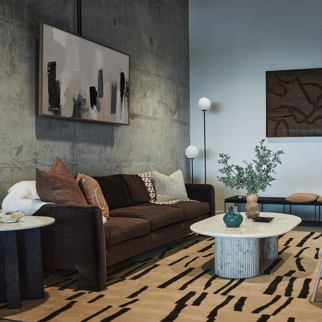 Abstract Artwork Anchors a Textured Concrete Wall