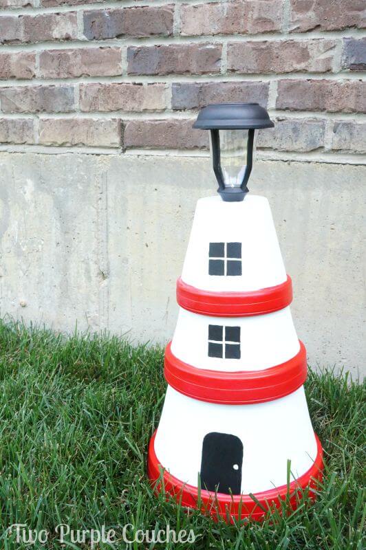 Stacked Terracotta Pots Create a Lighthouse Solar Lamp