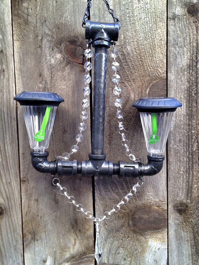 Industrial Pipe Chandelier Holds Two Solar Lights
