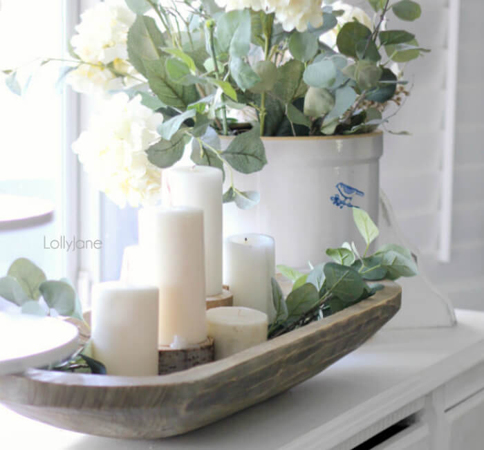 Grouped Pillar Candles with Greenery in a Carved Bowl