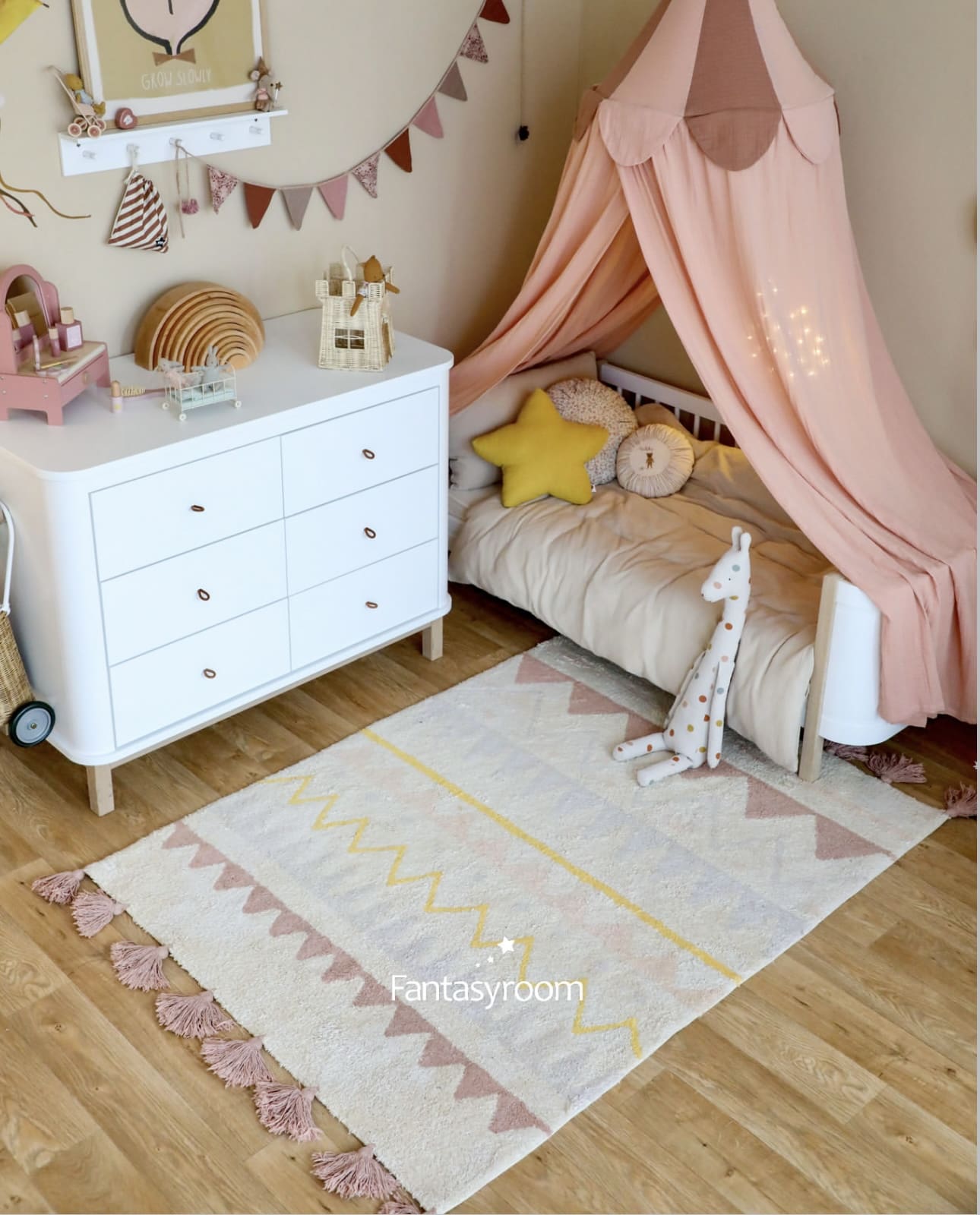 Pink Canopy With String Lights Creates a Magical Bedtime Atmosphere